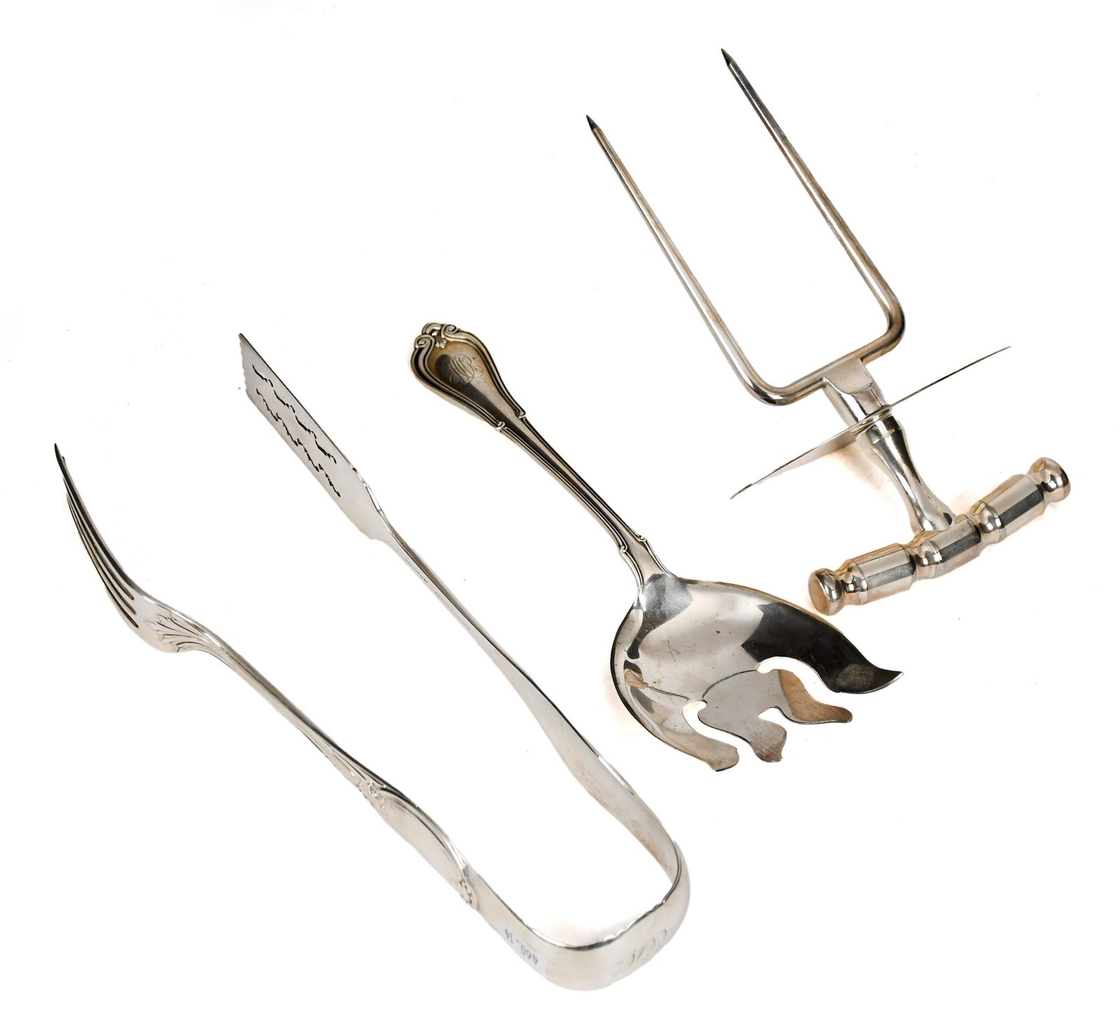 ANTIQUE SILVER TABLE SERVICE IMPLEMENTS.: Three antique silver table service implements including, a sterling cold meat fork, monogrammed, 3.00 oz t. 8.5”L, a coin silver asparagus tong with acanthus decoration and monogrammed at the