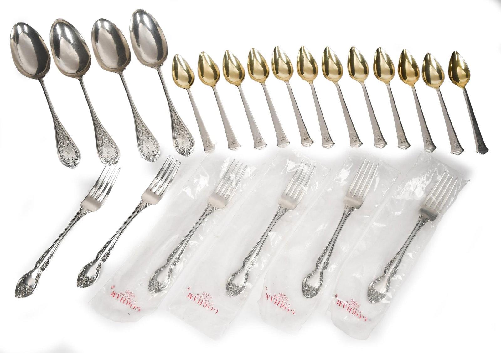 22 PCS STERLING FLATWARE, TIFFANY, AND OTHERS.: 22 pieces of sterling flatware including, four large dinner spoons, M. S. Smith & Co., 6.95 oz t. 8.5”L. along with 12 Tiffany & Co. tea spoons, 14.25 oz t. 5.75”L. and six Gorham dinner