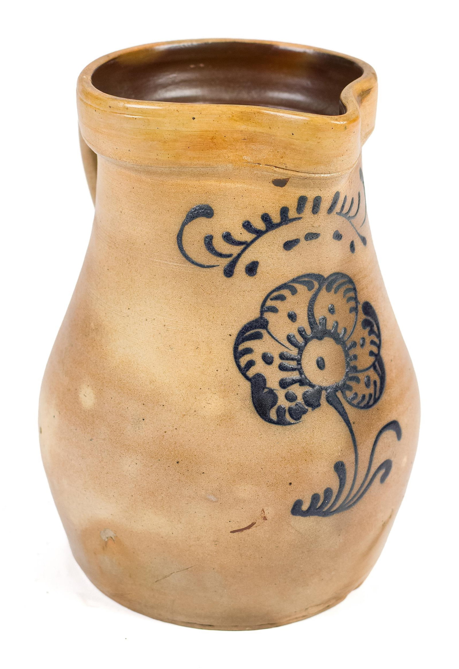 19TH C. STONEWARE POURING PITCHER, BLUE FLOWER.: A 19th C. stoneware batter pitcher with cobalt flower and other design, with an applied handle, likely New York State, 10”H