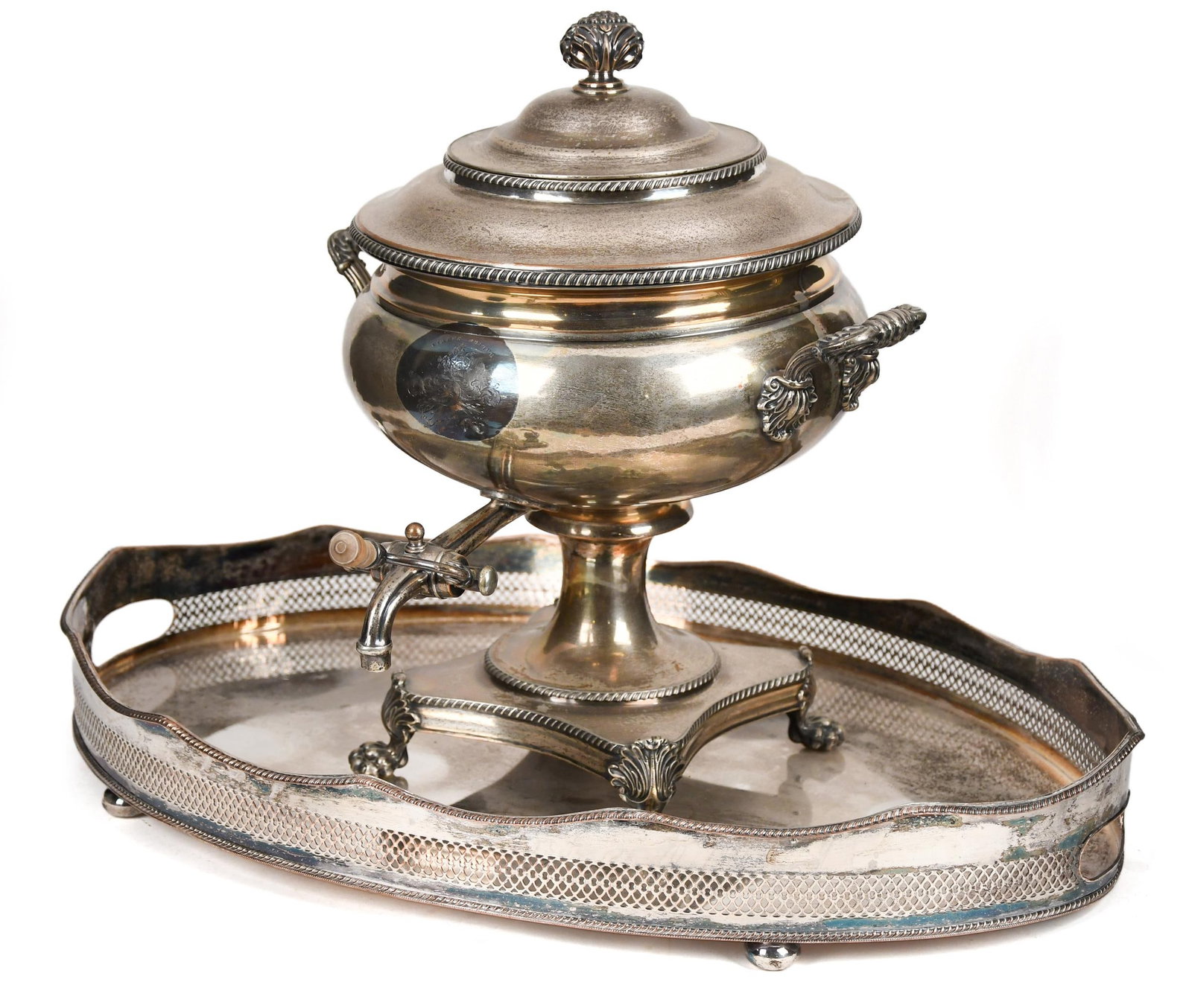 ANTIQUE SHEFFIELD HOT WATER URN.: An antique Sheffield silver plate hot lidded water urn with handles, spigot, and four claw feet, 16”H x 13” handle to handle, along with a Sheffield serving tray, 3.25”H x