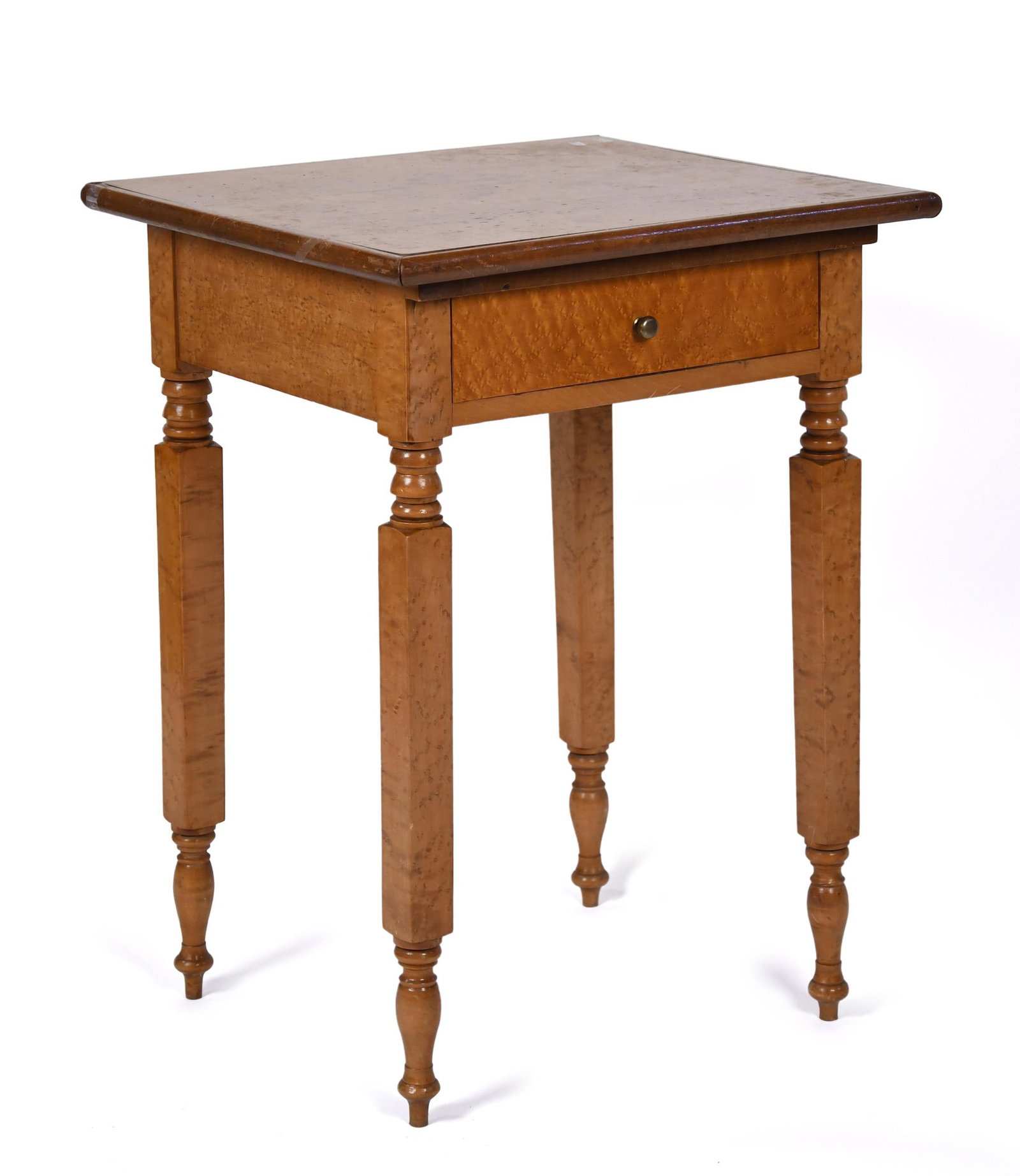 19TH C. NEW YORK BIRDSEYE MAPLE STAND.: A ca. 1850 American birdseye one drawer stand in solid birdseye maple. Top with mahogany edge molding, on New York State turned legs. 29.25”H x 21.5”W x 19.5”D