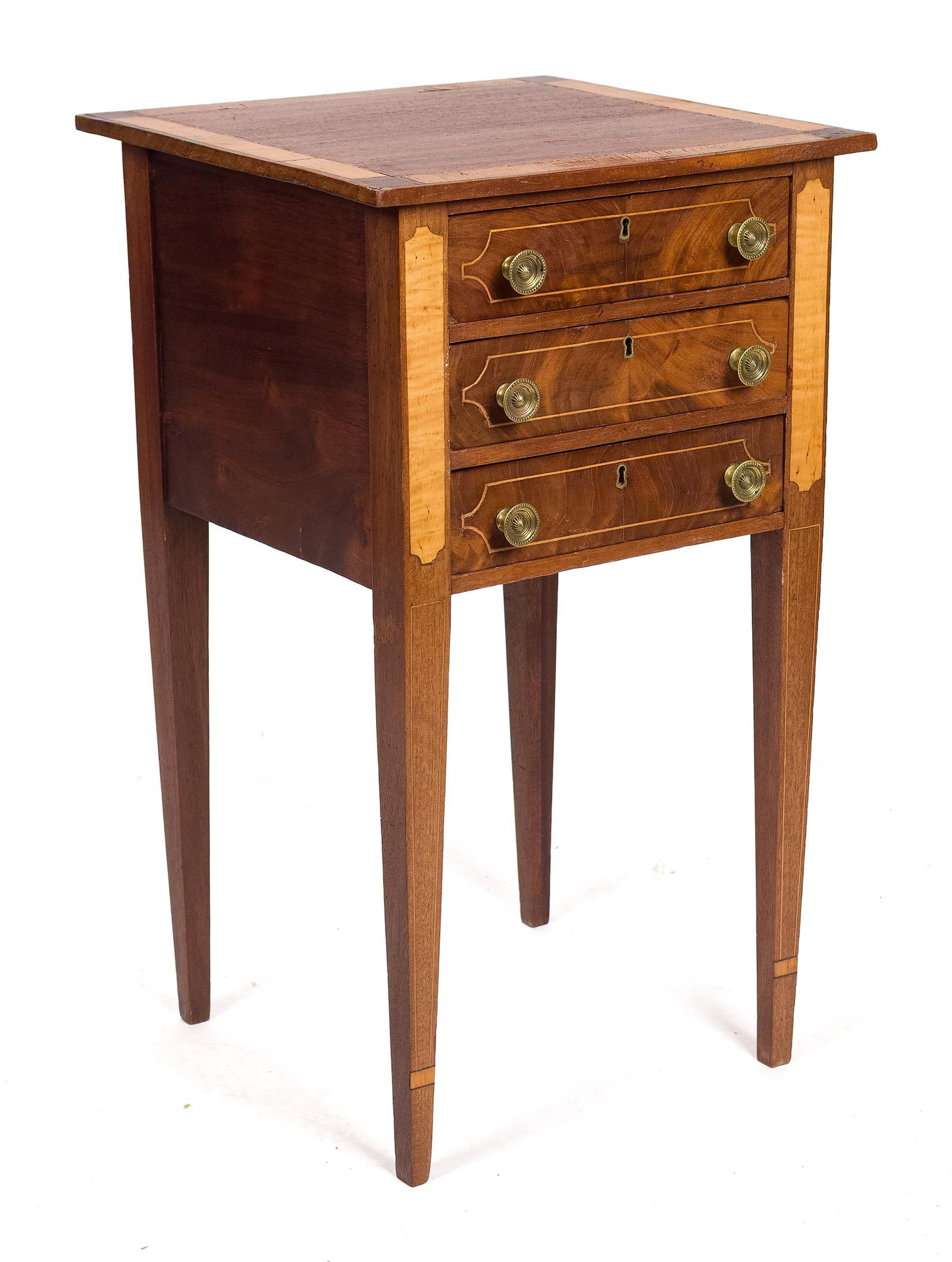ANTIQUE INLAID HEPPLEWHITE THREE DRAWER STAND.: A 19th C. Hepplewhite mahogany three drawer stand with tiger maple and other veneers, on tapered legs. 29.75“H x 17.5“w x 16.5“D
