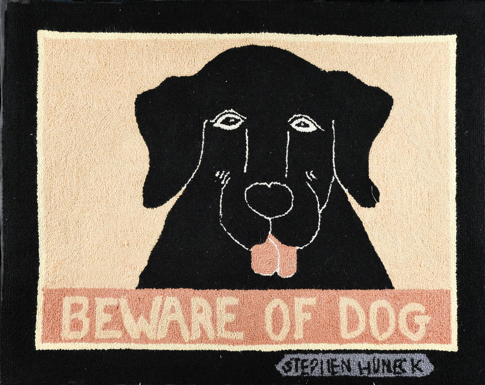 STEPHEN HUNECK HOOKED RUG, BEWARE OF DOG.: A vintage Stephen Huneck signed and mounted hooked rug, ‘Beware of Dog’. 29” x 37”.