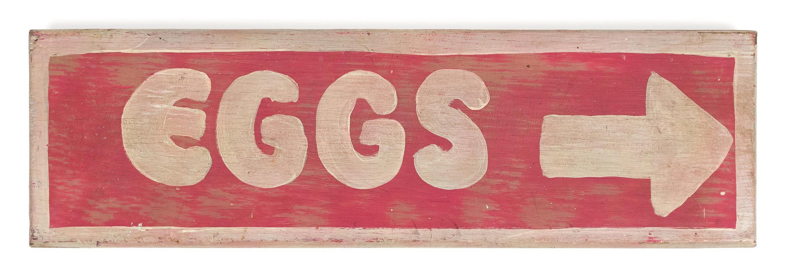 VINTAGE EGGS SIGN.: An over painted oak wood EGGS sign in white letters on red, indications of earlier paint, 5.5” x 19”. Provenance: from the lifelong, curated collection of Kathy Schoemer, Walpole, NH.