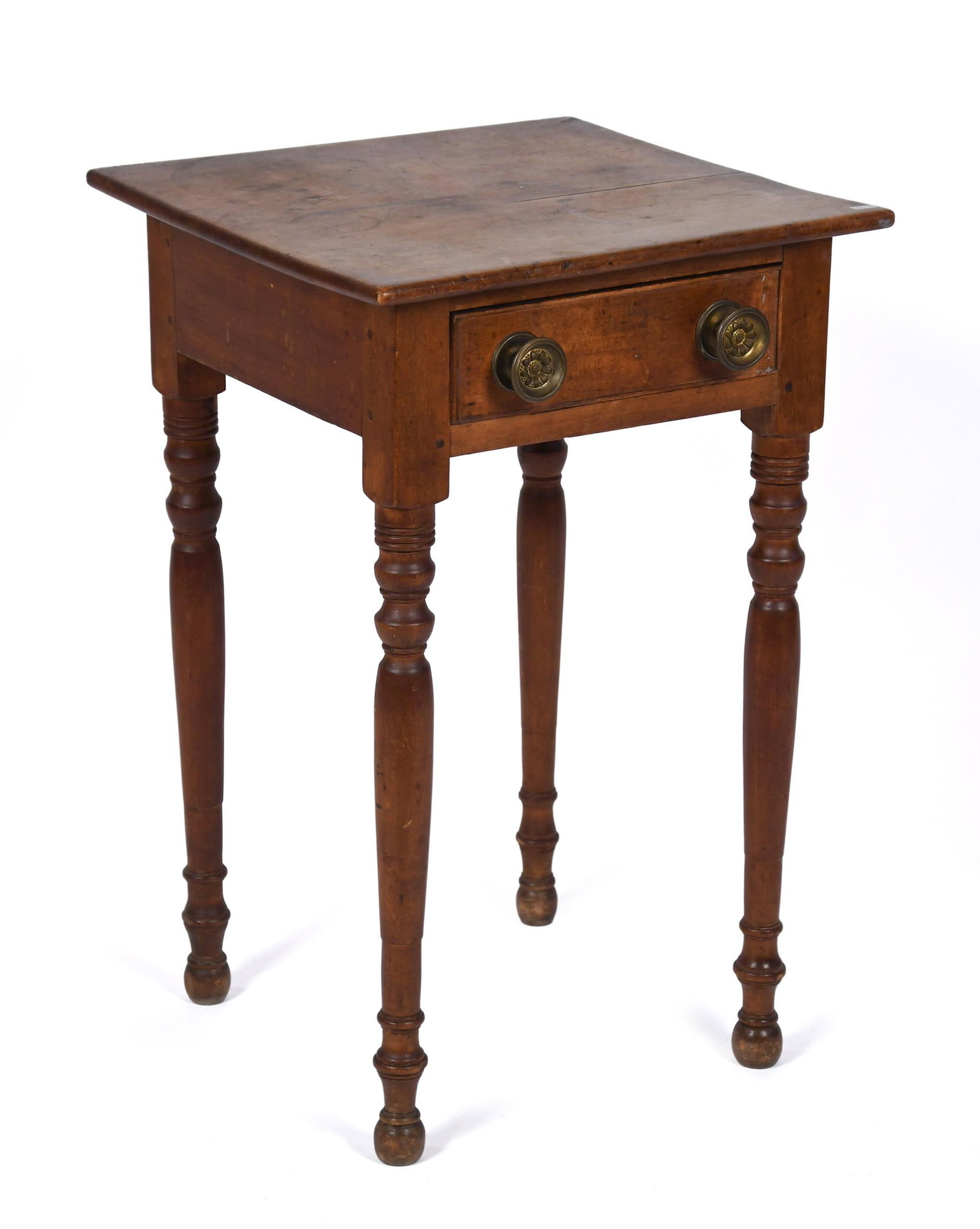 19TH C. AMERICAN SHERATON MAPLE ONE DRAWER STAND.: A ca. 1820 American Sheraton maple one drawer stand in old color, on turned legs. 28.25”H x 18” x 18” top.