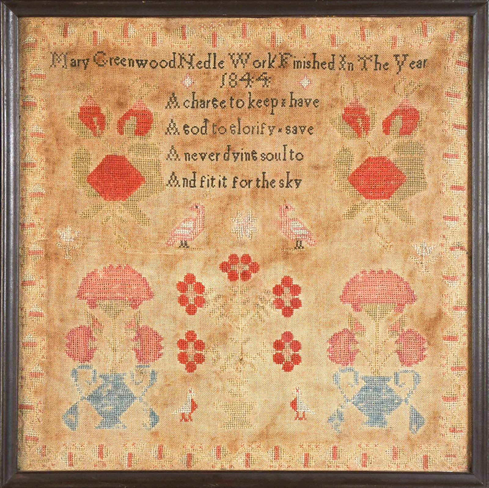 1844 MARY GREENWOOD SAMPLER.: A 19th C. needlework sampler with verse floral motif and patterned border. Verse, ‘Mary Greenwood Needle Work Finished In The Year 1844 A charge to keep x have A god to glorify x save A never