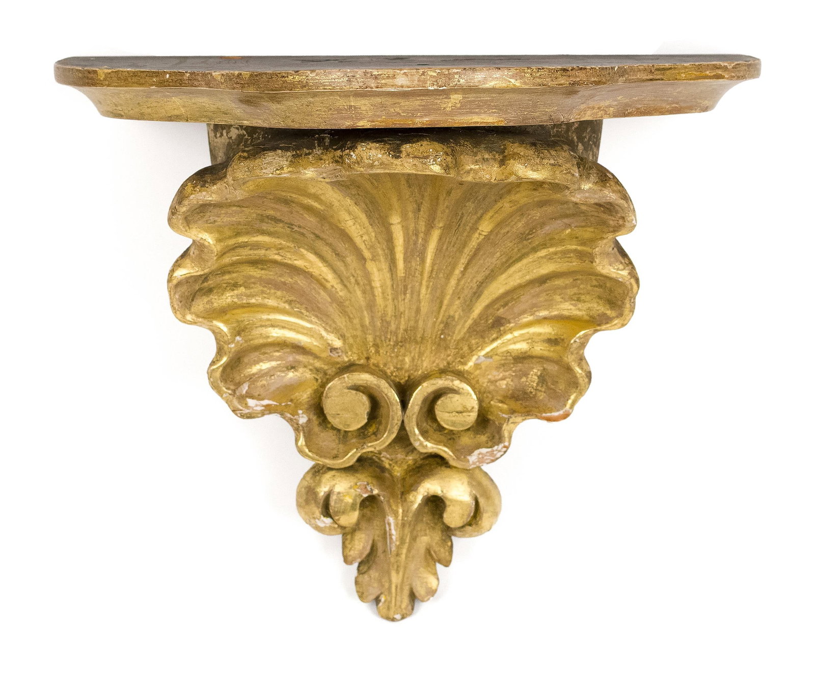 19TH C. CARVED AND GILT SHELL WALL BRACKET.: A 19th C. carved wood and gilt decorated shell form wall bracket. 12”H x 14”W x 8”D.