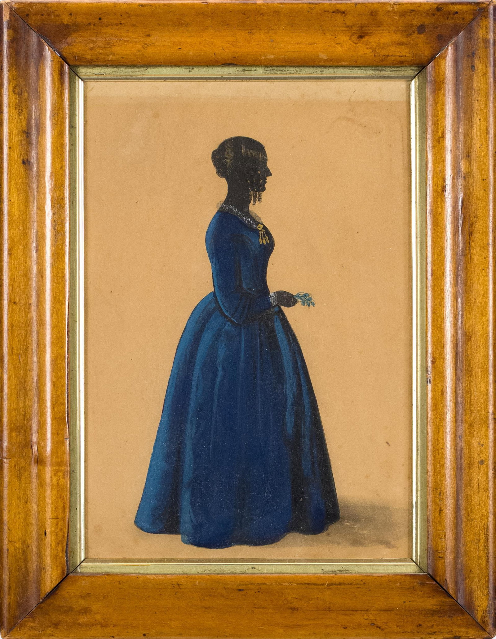 19TH C. GEORGE CROWHURST ATTRIBUTED SILHOUETTE .: A ca. 1830 George Crowhurst (1827-1844) attributed full length silhouette of a woman in blue dress, holding a sprig of flowers, unsigned. Image 9.5” x 6.5”, Frame 13” x 10”.