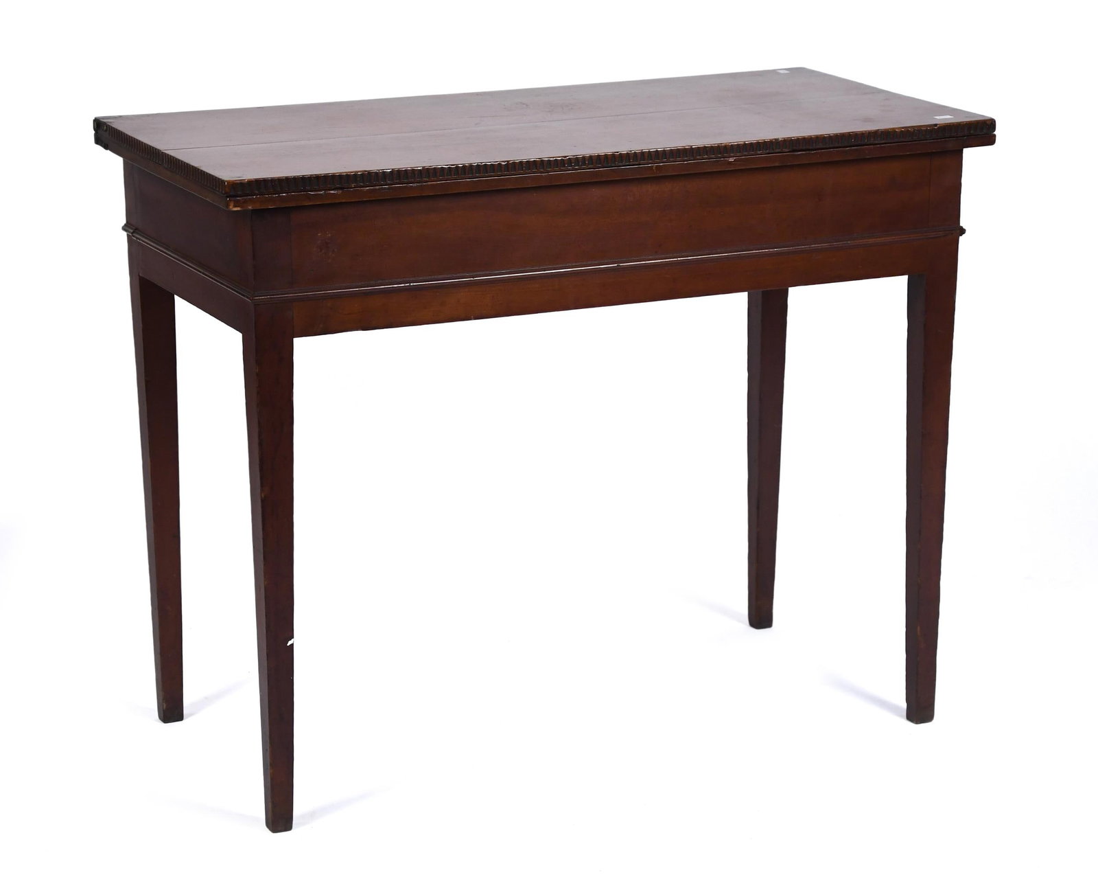 EARLY 19TH C. CARVED RI CHERRY CARD TABLE.: A ca. 1810 Rhode Island cherry card table with an exceptional chipped carved top edge and molded apron, on tapered legs. 28.5”H x 36”W x 17.75”D.