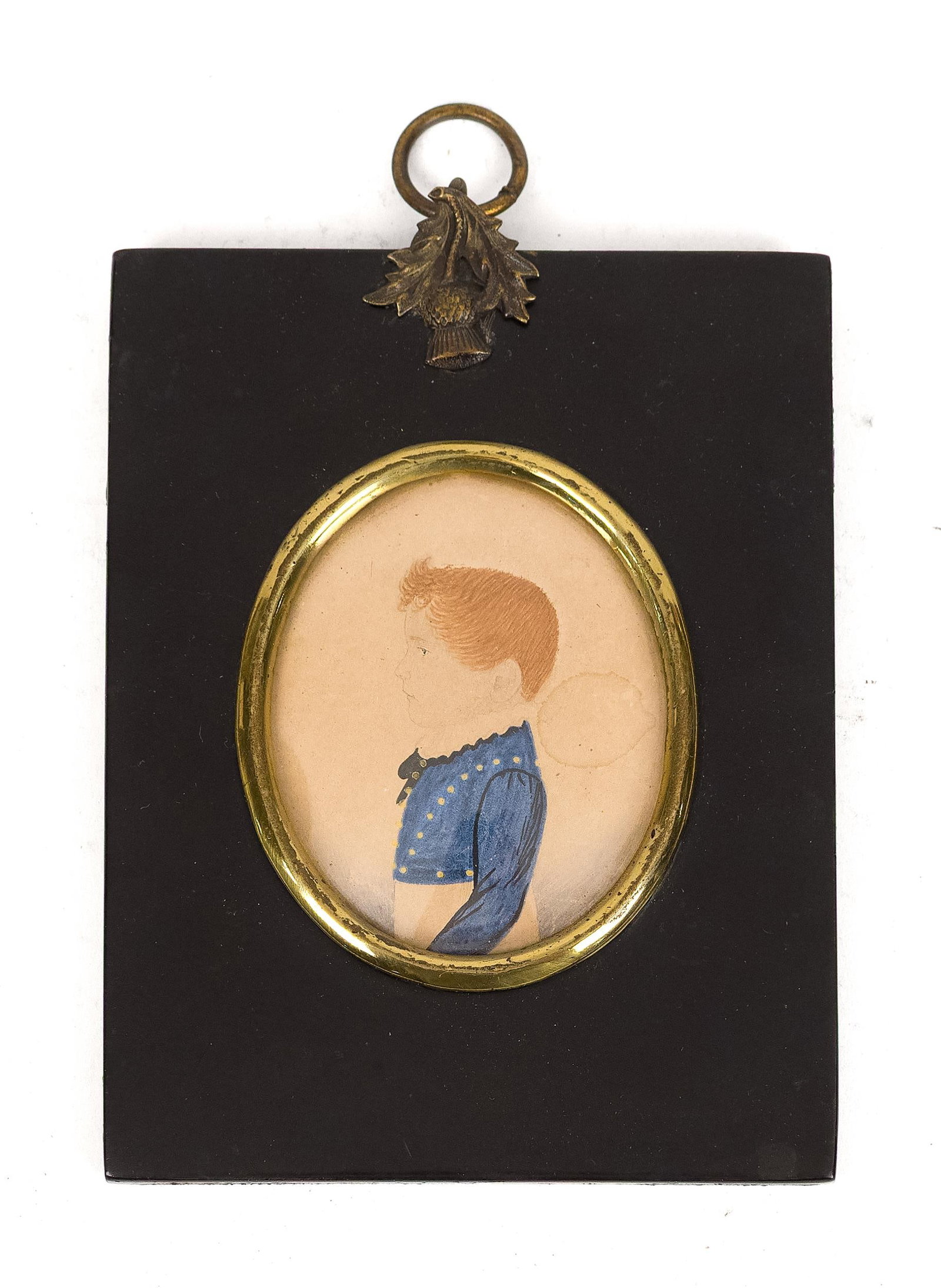 19TH C. MINIATURE PAINTING RED HAIR BOY IN BLUE.: An early 19th C. miniature painting of a young red haired boy in a blue coat standing profile,. Image 2.75” x 2.25” Frame 5” x 4”.