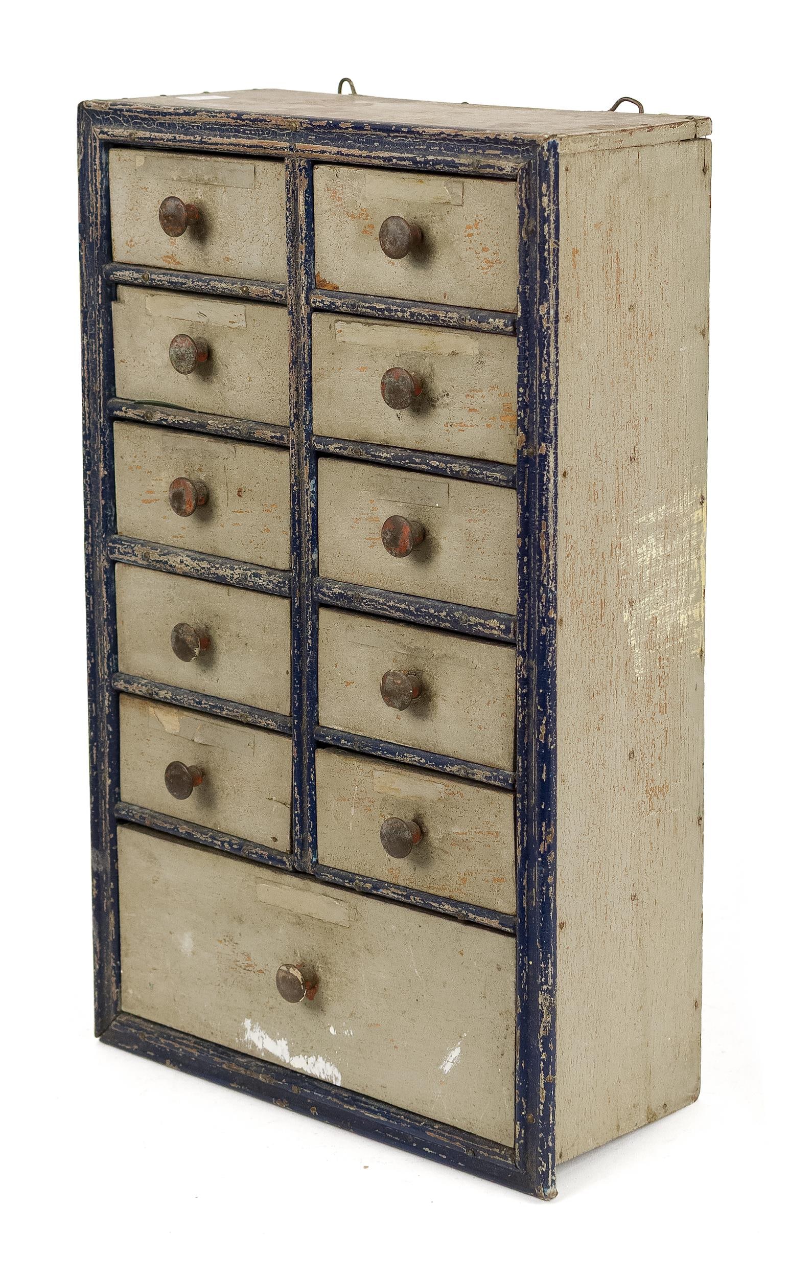 ANTIQUE WALL HANGING SPICE BOX.: An antique 11 drawer wall hanging spice box with blue painted highlights on grey ground. 15.5”H x 10”W x 4”D.
