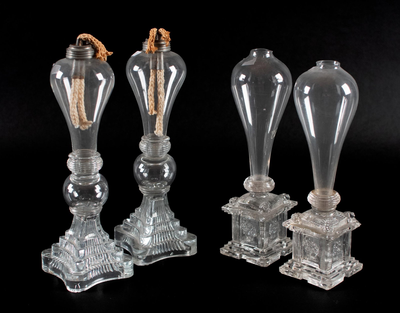 TWO PR. 19TH C. BULB-SHAPED GLASS WHALE OIL LAMPS.: One pair with metal collars and wicks. The other with circular open tops. 11”Hx 4” dia. and other pair, 12.5”H x 5” dia.
