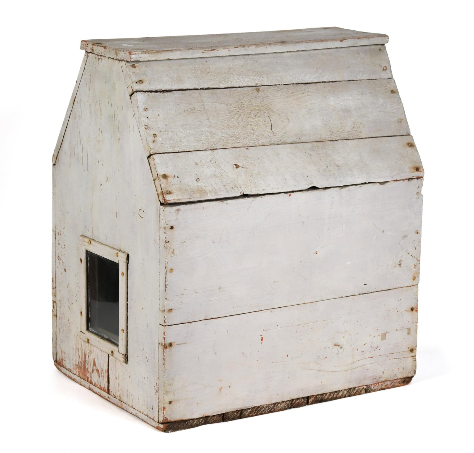 VINTAGE WHITE PAINTED DOLL HOUSE.: An early 20th C. white painted house with central glass windows flanking the long sides and one hinged access door, of New York origin. 23.5”H x 20”W x 15.25”D. Provenance: from the 