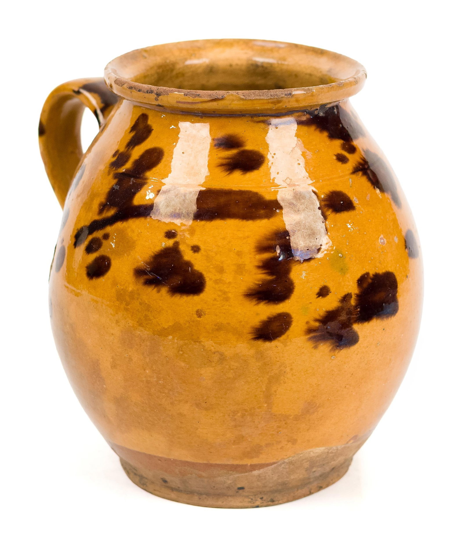 19TH C. REDWARE STORAGE JAR WITH HANDLE.: A 19th C. redware storage jar with an applied handle and spotted manganese decoration, 8”H.