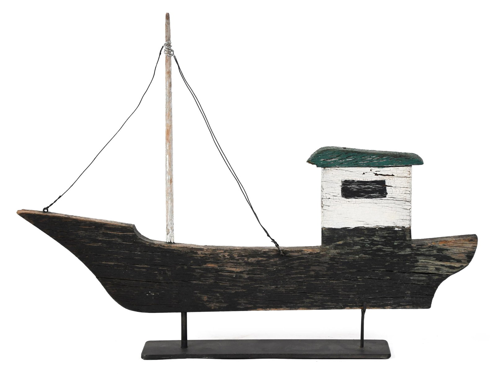 ANTIQUE FOLK CARVING, TRAWLER BOAT ON STAND.: A 19th C. folk art carving of a trawler boat, painted with a bespoke metal mount. 14”H x 18”L. Provenance: from the lifelong, curated collection of Kathy Schoemer, Walpole, NH.