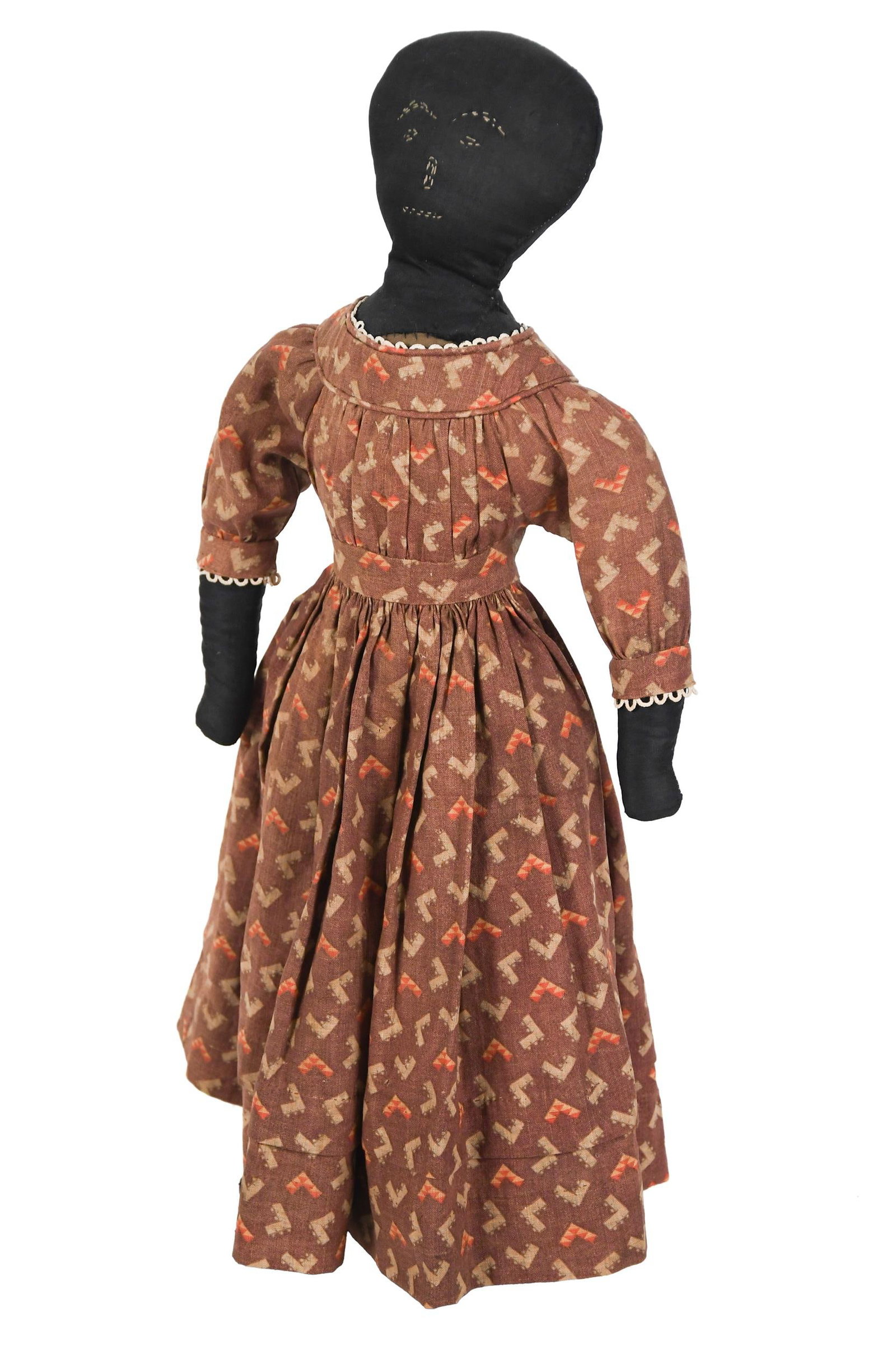 19TH C. CLOTH DOLL WITH STITCHED FACE.: A ca. 1880 cloth doll with stitched face and period clothing. 22”H. Provenance: from the lifelong, curated collection of Kathy Schoemer, Walpole, NH.
