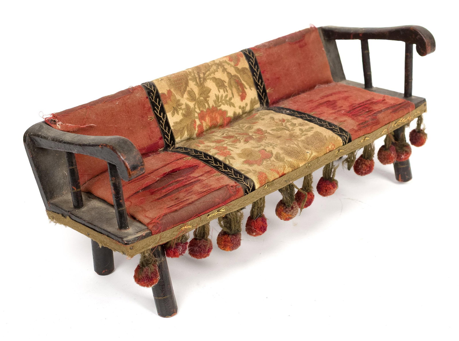 CHARMING ANTIQUE DOLLS DEACON BENCH.: A mid-19th-century doll size paint decorated deacon’s bench with original fabric, upholstered seat with charming strawberry, tassels frame and original black paint with yellow pinstripe,