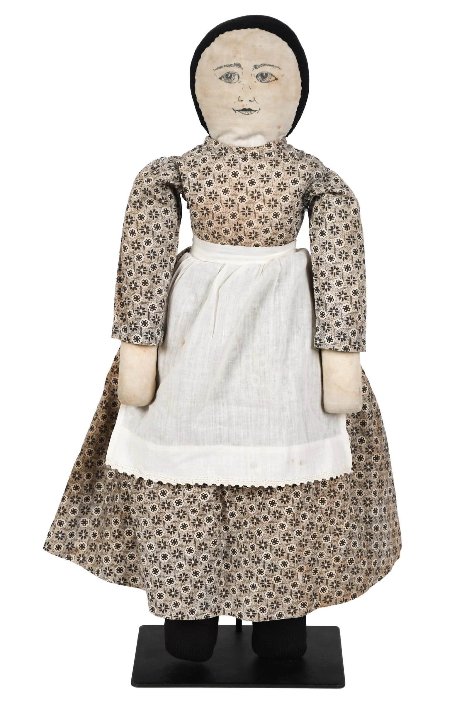 ANTIQUE CLOTH DOLL WITH EXCELLENT FACE.: A late 19th C. cloth doll in original period dress and apron with nicely painted, expressive, large eyed face. 18.5”H. Provenance: from the lifelong, curated collection of Kathy Schoemer,