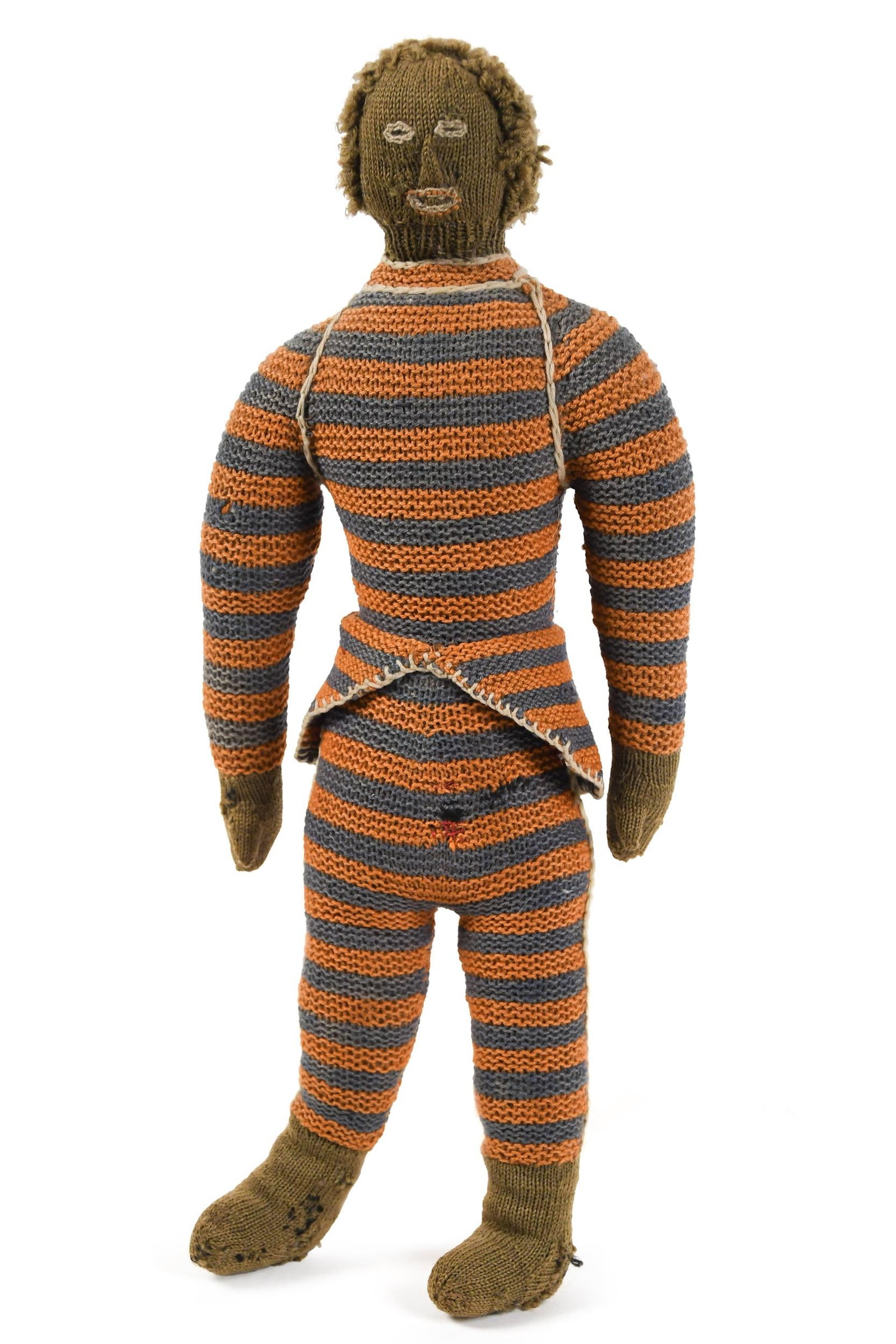 ANTIQUE KNITTED DOLL IN HORIZONTAL STRIPES.: A ca. 1890 knitted doll from the Madeline Osborne Merrill Collection and pictured in her book, The Art of Dolls. 18”H. Provenance: from the lifelong, curated collection of Kathy Schoemer,