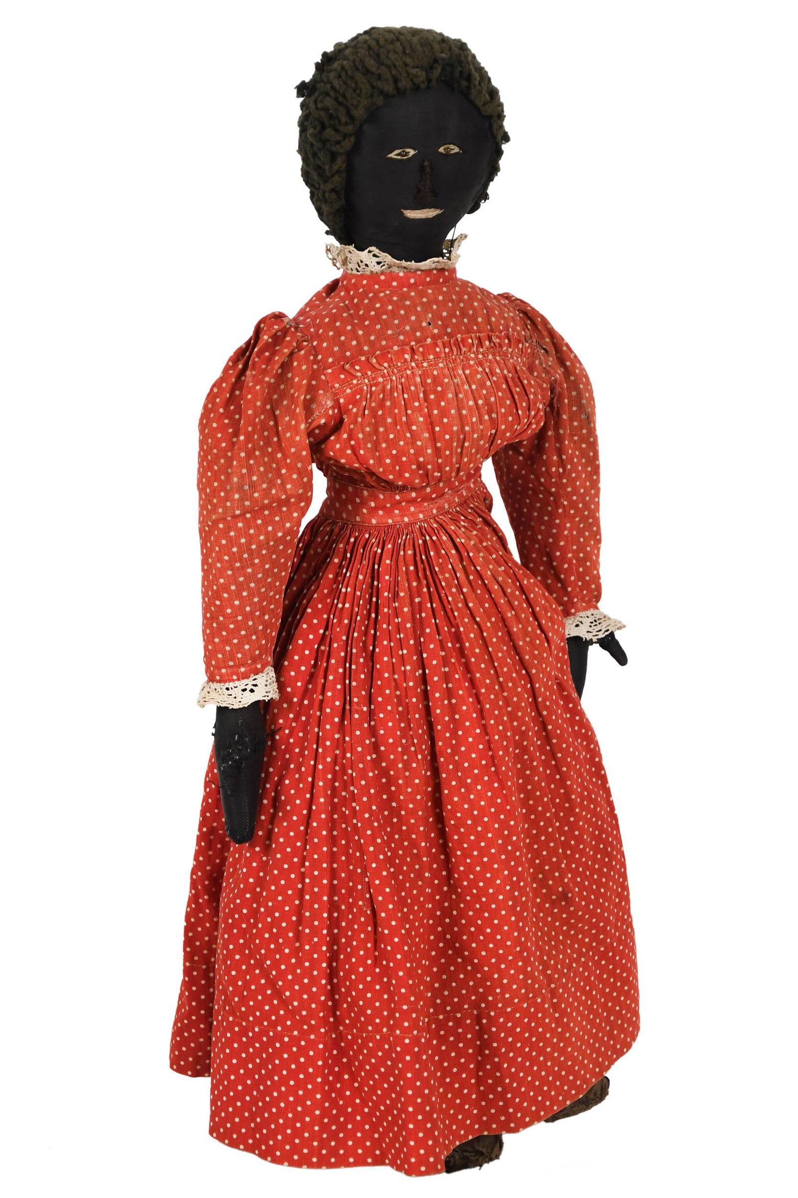 19TH C. CLOTH DOLL IN ORIGINAL PERIOD DRESS.: A ca. 1880 cloth doll with embroidered face, pinpoint glass eyes, and original dress and shoes. 20.5”H. Provenance: from the lifelong, curated collection of Kathy Schoemer, Walpole, NH.