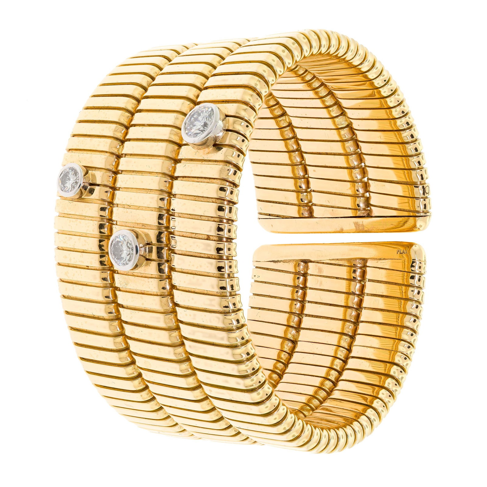 18K GOLD TIFFANY & CO. PALOMA PICASSO DIAMOND CUFF.: A signed, Tiffany & Co. by Paloma Picasso, 18k yellow gold (stamped), flexible, cuff bracelet, set with three, approx. 1.13 ct. tw., round brilliant cut, natural diamonds of G-H-I color and VS