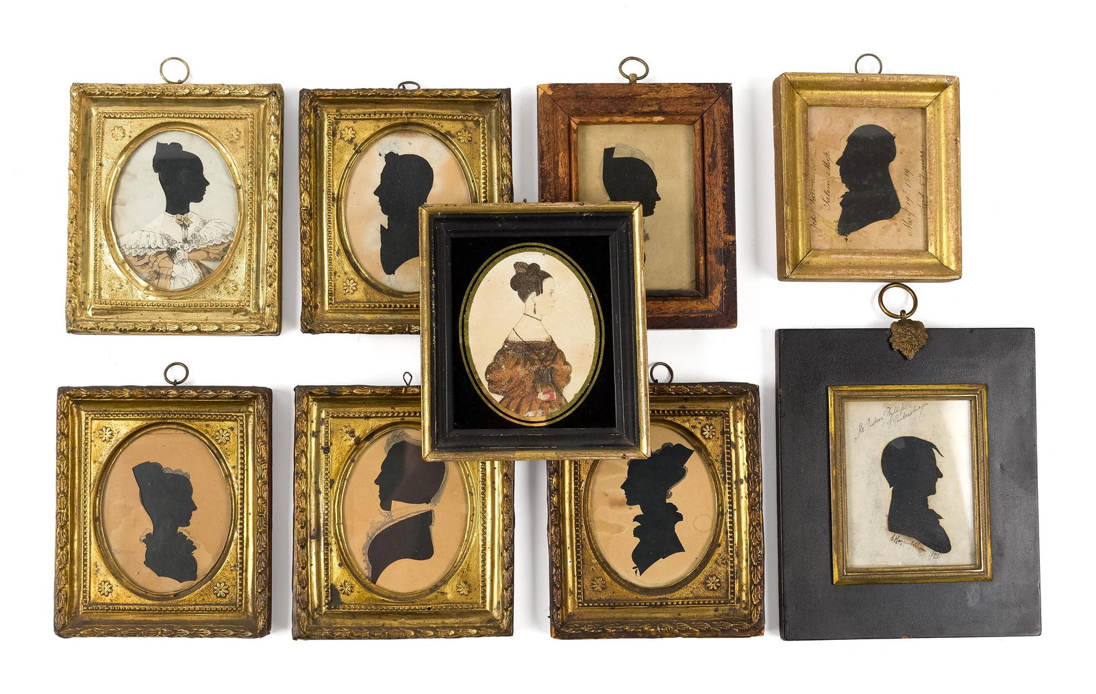 NINE 19TH C. SILHOUETTES AND MINIATURES: Nine 19th C. American silhouettes and miniature portraits, all framed, including: a hollow cut profile of a gentleman, inscribed Salem, Mass. and dated May 19th 1849, noted as died 57 years; a cut