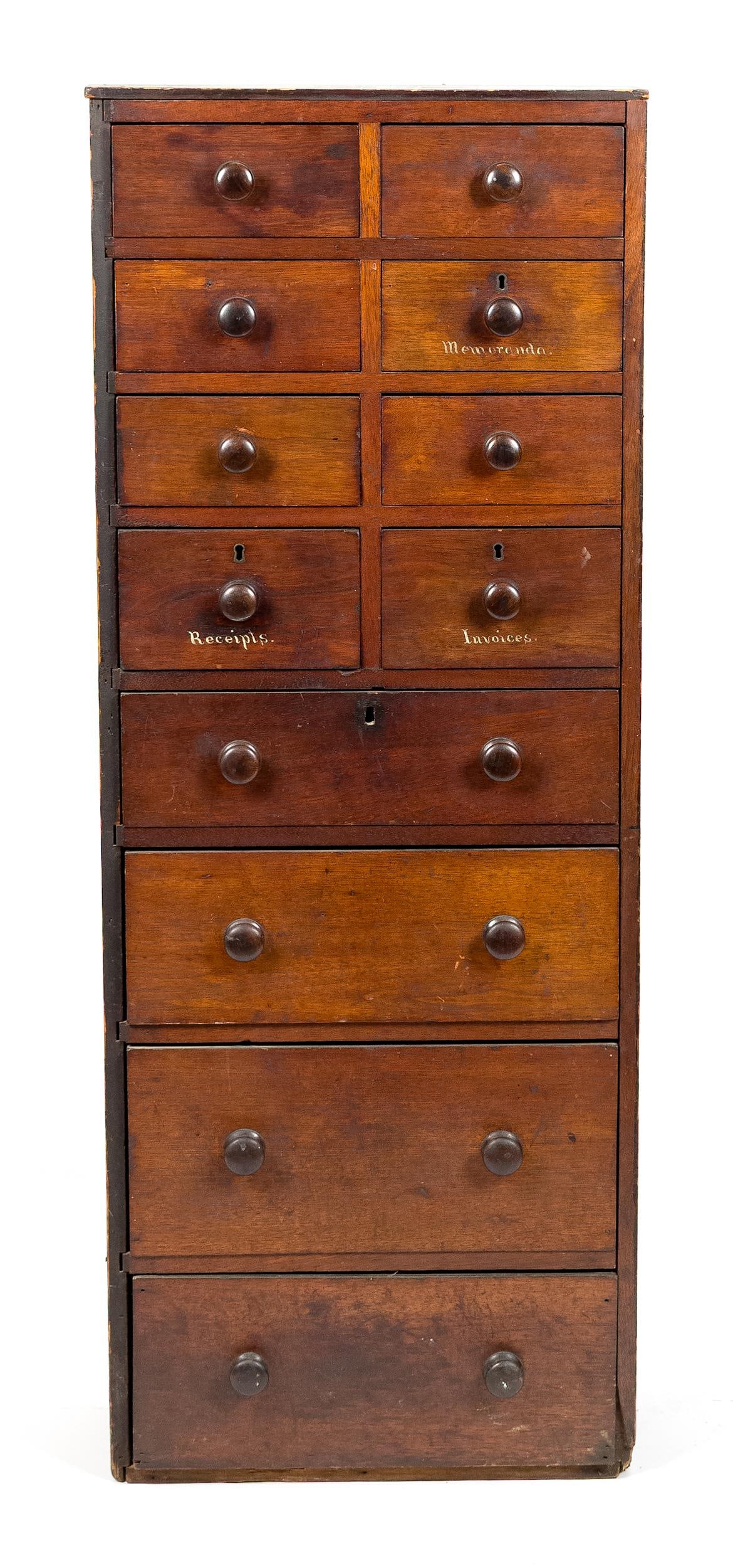 19TH C. MULTI DRAWER APOTHECARY.: A country 19th C. American walnut and pine secondary wood, 12 dovetailed drawer floor standing apothecary in a lovely petit upright form with old color. 52”H x 19.5”W 9”D.
