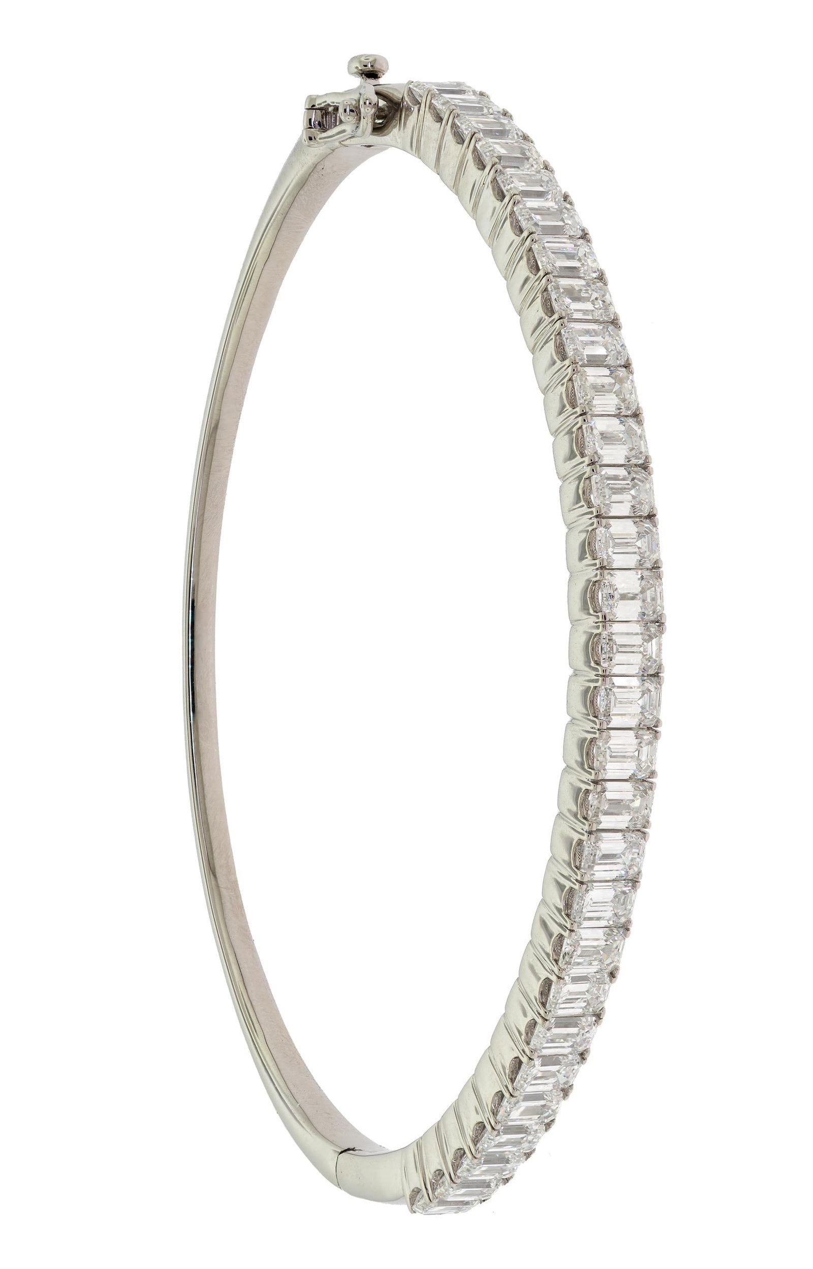 PLATINUM 5 CT. EMERALD CUT DIAMOND BANGLE BRACELET.: A platinum (stamped), hinged, bangle bracelet, set with exactly 5.63 ct. tw., emerald cut, natural diamonds of G-H color and VVS clarity, each stone measuring approx. 4 x 3mm, 6 3/4 inch wrist, 4mm