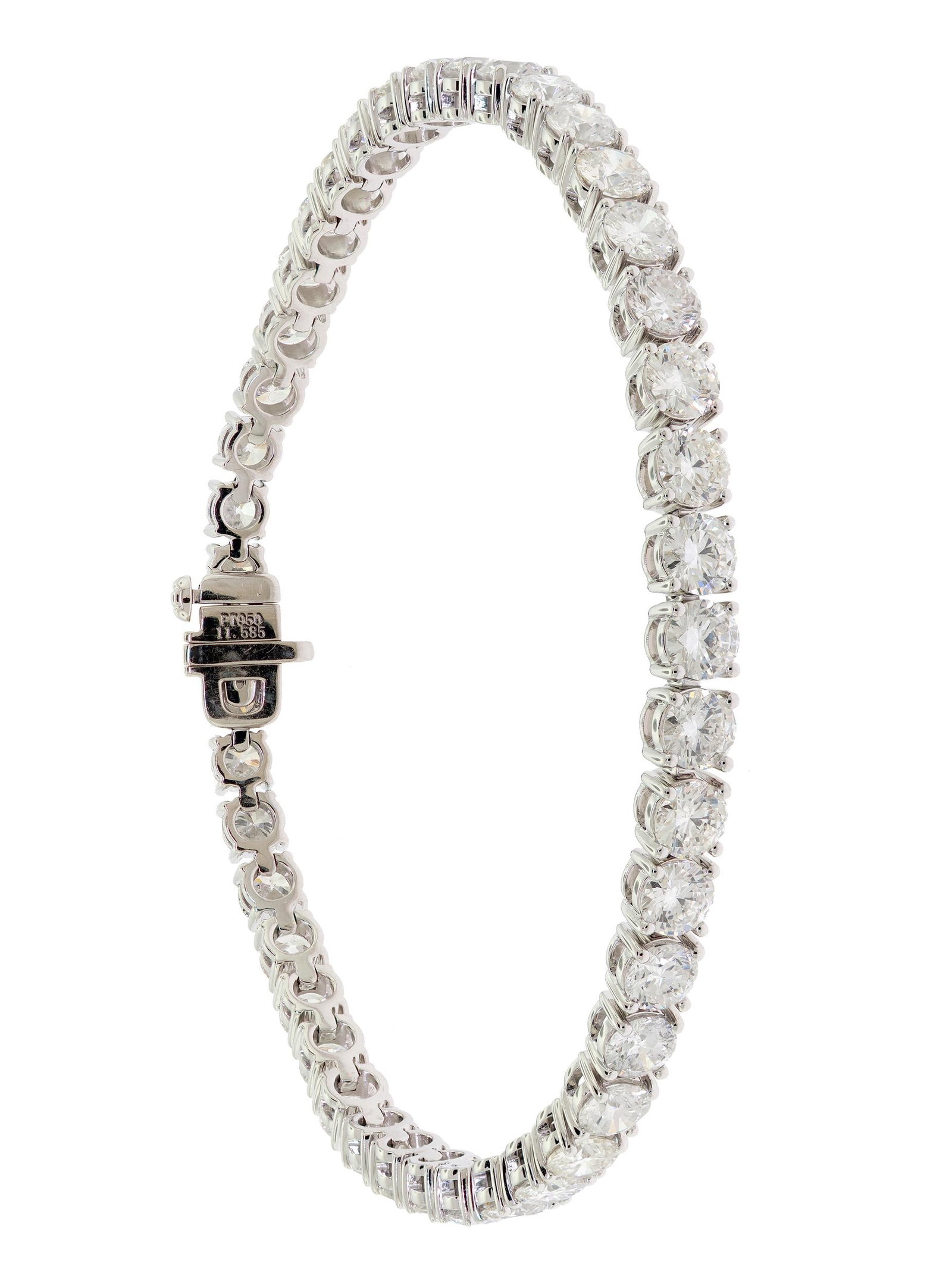 PLATINUM 11 CTW DIAMOND TENNIS BRACELET.: A platinum (stamped), tennis bracelet, set with exactly, 11.58 ct. tw., round brilliant cut, natural diamonds of G-H-I color and VS-SI clarity, 7 3/8 inches long, 24.4 grams. Tested as natural mined d