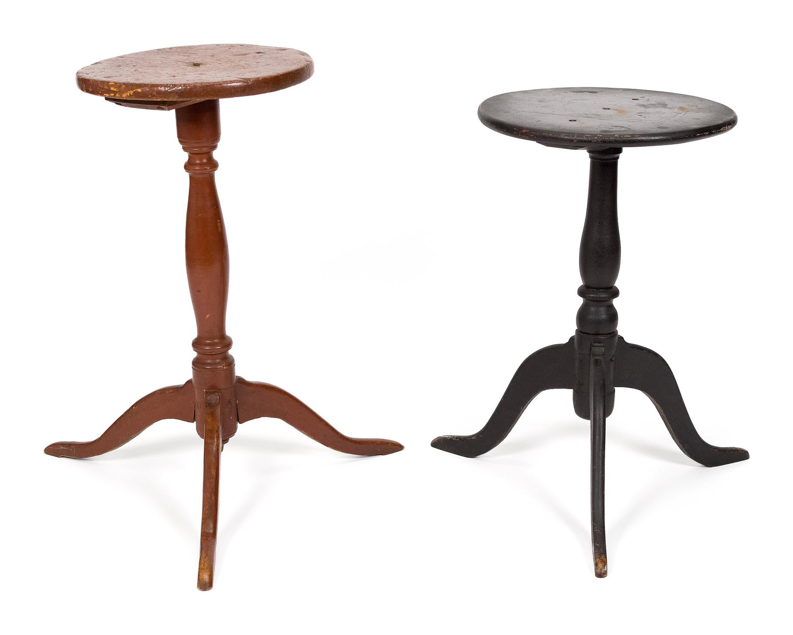 TWO 19TH C. QUEEN ANNE PAINTED CANDLE STANDS.: Two ca. 1810 country Queen Anne candle stands, including: one in old red paint, the circular top on a vase and ring turned standard, raised on three arched spider legs, 27”H, top 13” dia.;
