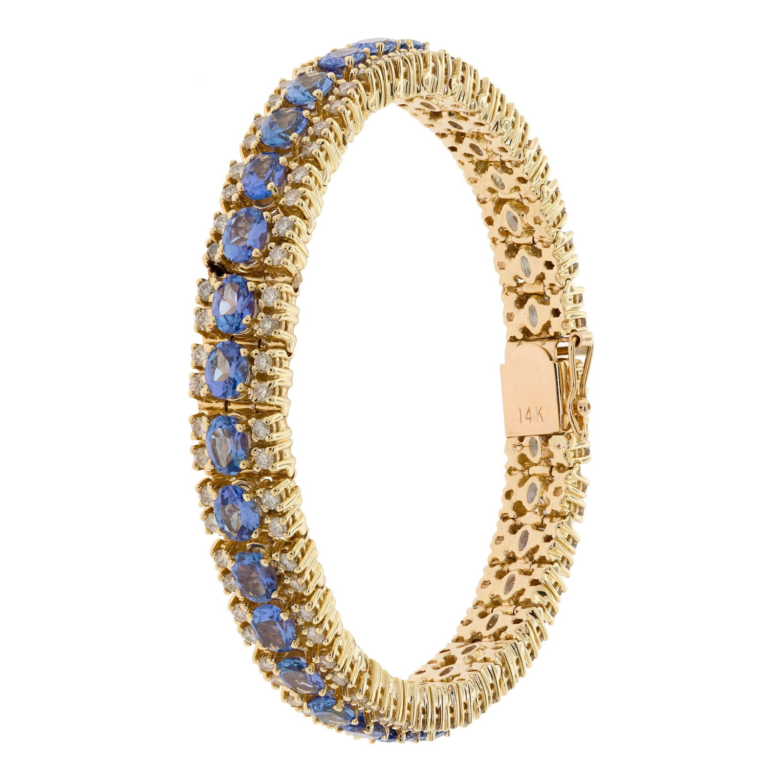 14K GOLD OVAL TANZANITE & DIAMOND BRACELET.: A 14k yellow gold (stamped), line bracelet, set with approx. 12 ct. tw., faceted oval, medium, violetish-blue, tanzanite and approx. 3.3 ct. tw., round brilliant cut, natural diamonds of