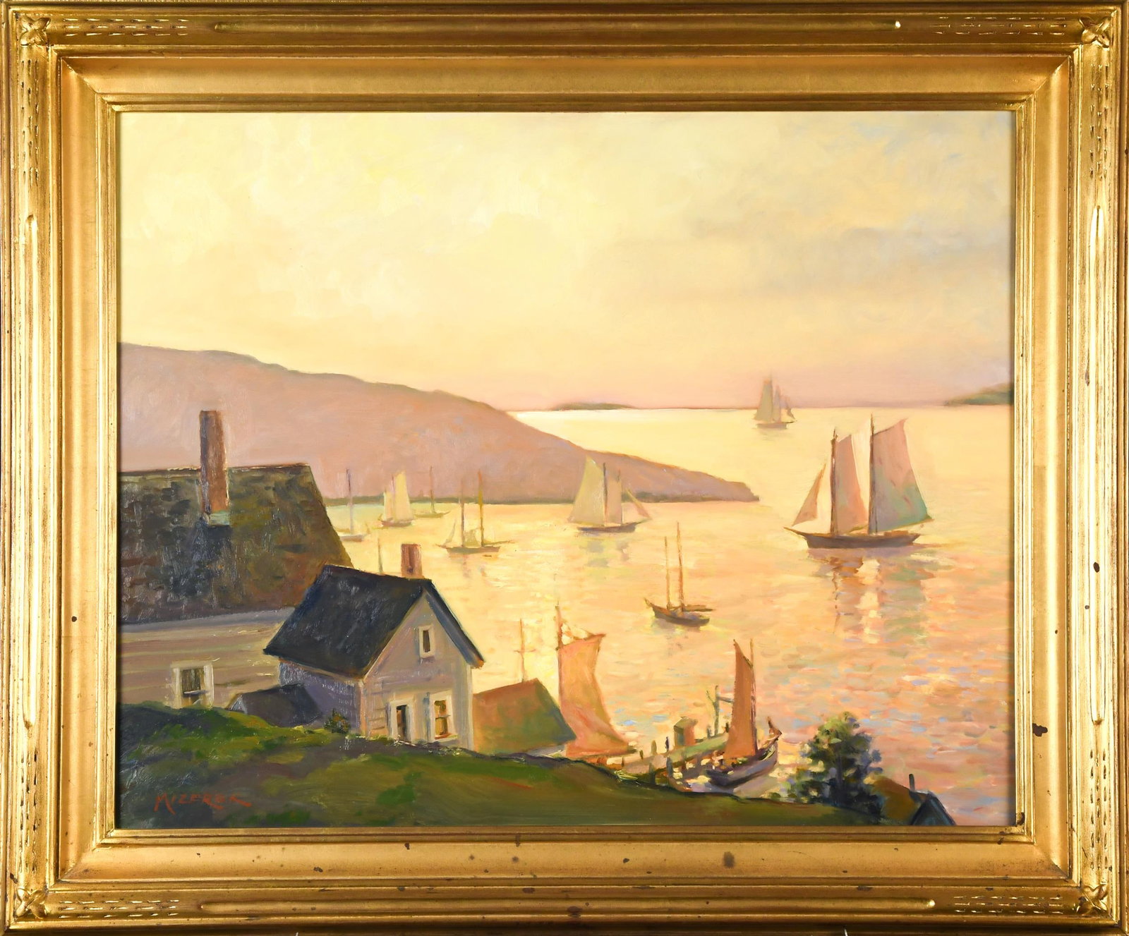 LEONARD MIZEREK OIL, GOLDEN HARBOR, MAINE.: A Leonard Mizerek oil on board, depicting a Maine coastal village and harbor at sunset, with hillside cottages overlooking sailboats and schooners illuminated by warm golden light of the sunset.