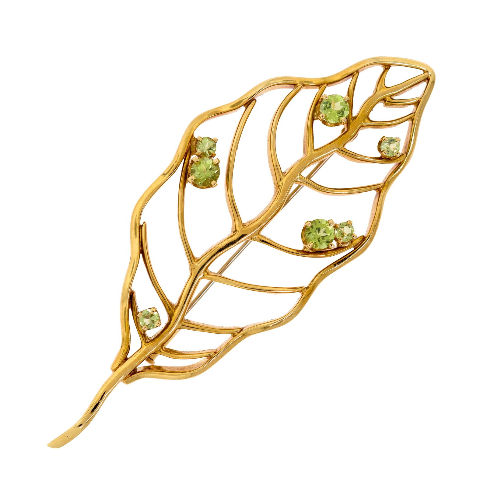 18K GOLD RAUFMANN DE SUISSE PERIDOT LEAF BROOCH.: An 18k yellow gold (stamped), Raufmann de Suisse, leaf brooch, set with faceted round, light yellowish-green peridot, 4.5 - 3mm round, 3 1/4 inches long, 30.7 grams, including original Raufmann de