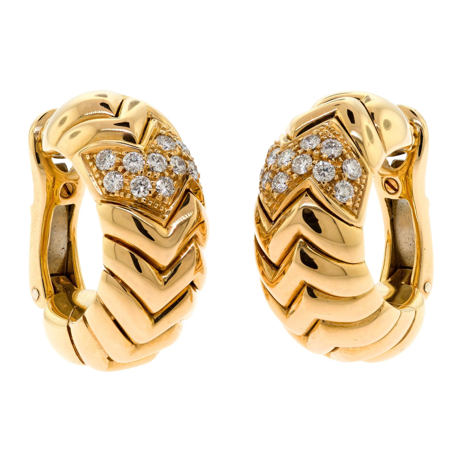 SIGNED BULGARI 18K GOLD DIAMOND CLIP EARRINGS.: A pair of signed Bulgari, 18k yellow gold (stamped), clip-on earrings, set with approx. .75 ct. tw., round brilliant cut, natural diamonds of F-G color and VS clarity, excellent cut, 1 inch long,