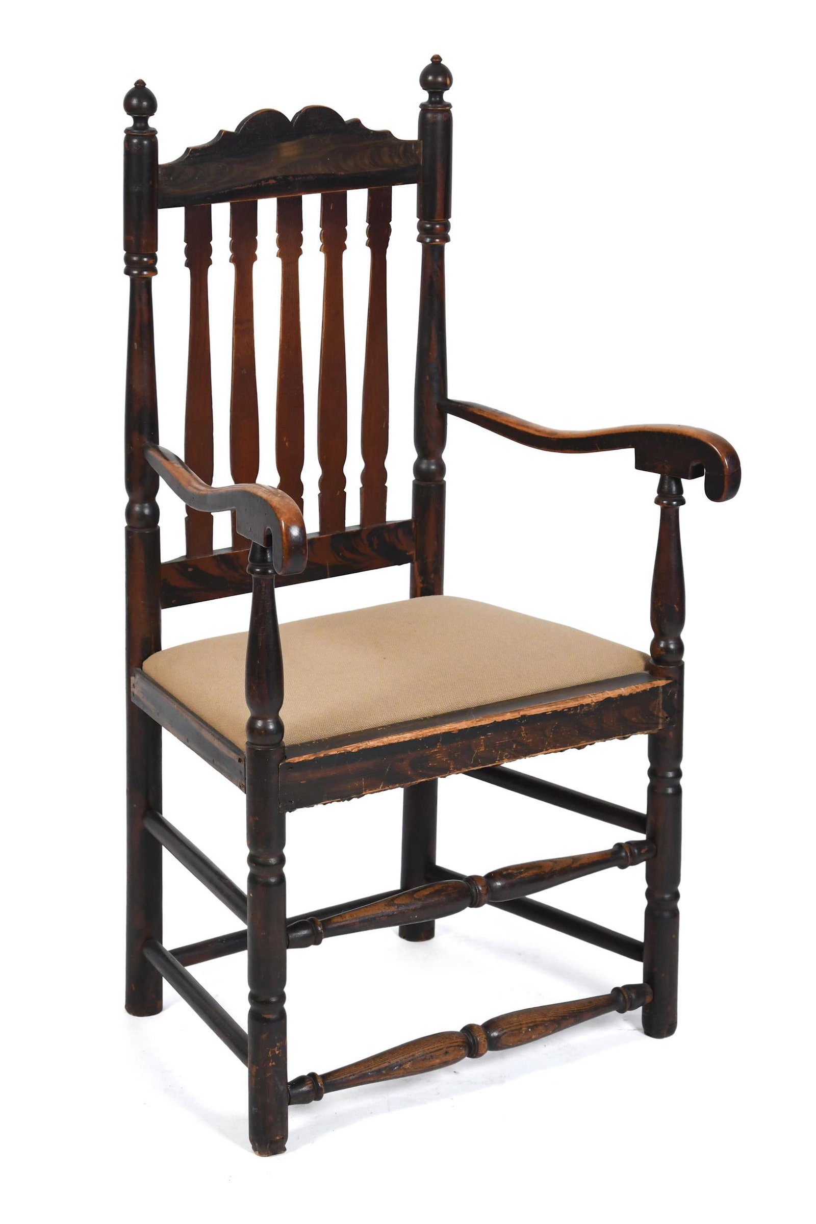 18TH C. NE GRAIN PAINTED BANISTER BACK ARMCHAIR.: An 18th C. New England banister back armchair, retaining its original grain painted surface. The shaped crest rail above five molded banisters, flanked by turned stiles with ball and flame finials,