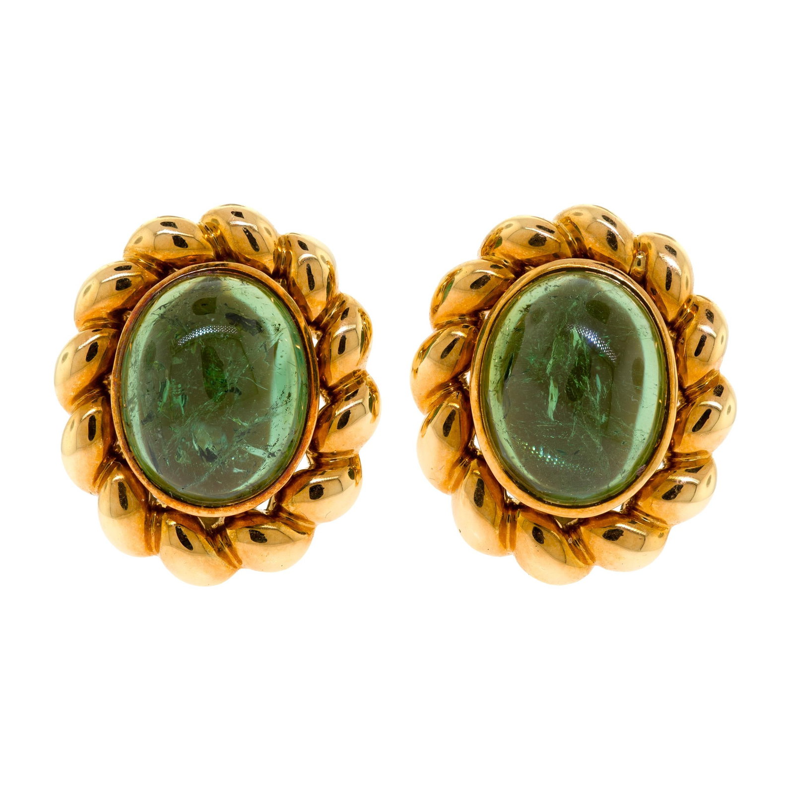 18K GOLD GREEN TOURMALINE CLIP EARRINGS.: A pair of 18k yellow gold (stamped, 1077 MI), clip-on earrings, marked Italy, set with approx. 18 ct. tw., medium green tourmaline cabochons, approx. 7/8 of an inch long, 24.4 grams. Provenance: a