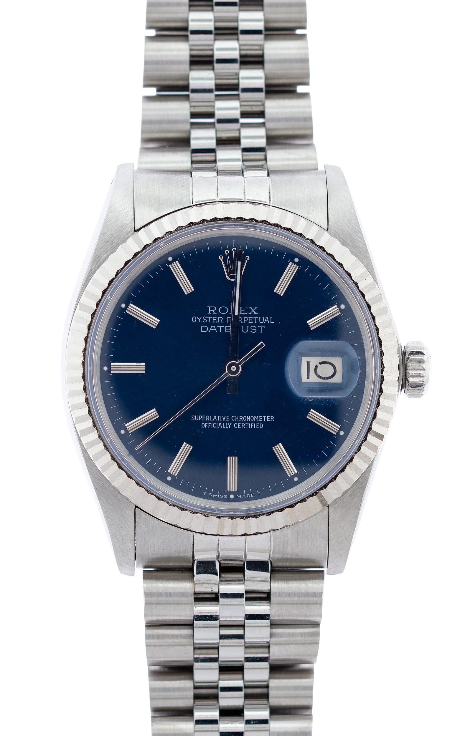 MENS ROLEX OYSTER DATEJUST WATCH W/BLUE DIAL.: A mens stainless steel, Rolex Oyster Perpetual, Datejust watch Reference #16014, with 18k white gold fluted bezel, cyclops lens, blue Rolex stick dial, 36mm case, Rolex jubilee bracelet, Superlative C