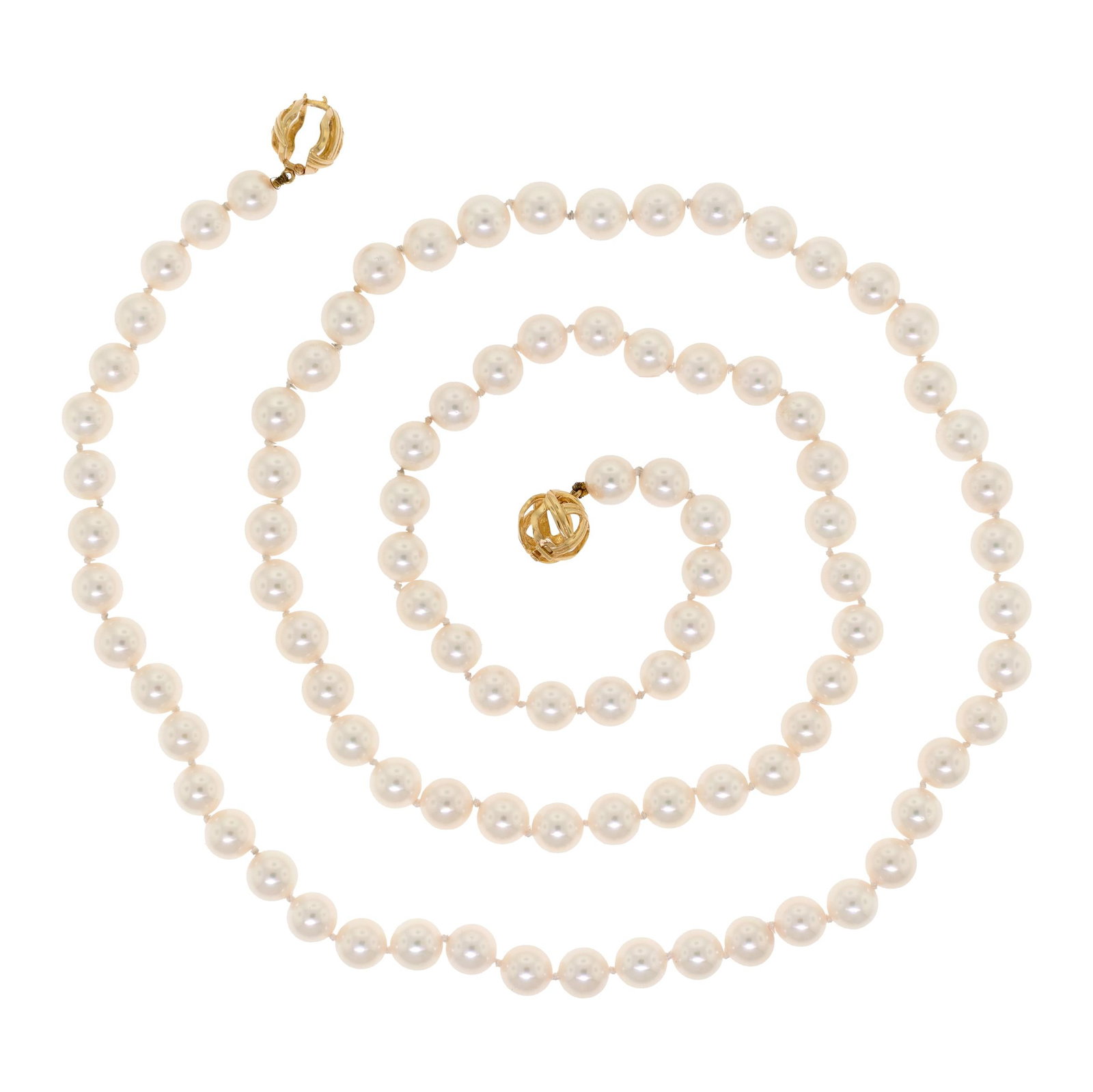 18K GOLD DOUBLE CLASP AKOYA PEARL NECKLACE.: An akoya pearl necklace with an 18k yellow gold (stamped), double, round basket clasp, knotted, 7mm round, white pearls with very good to excellent luster, very minor blemishes, 30 inches long.