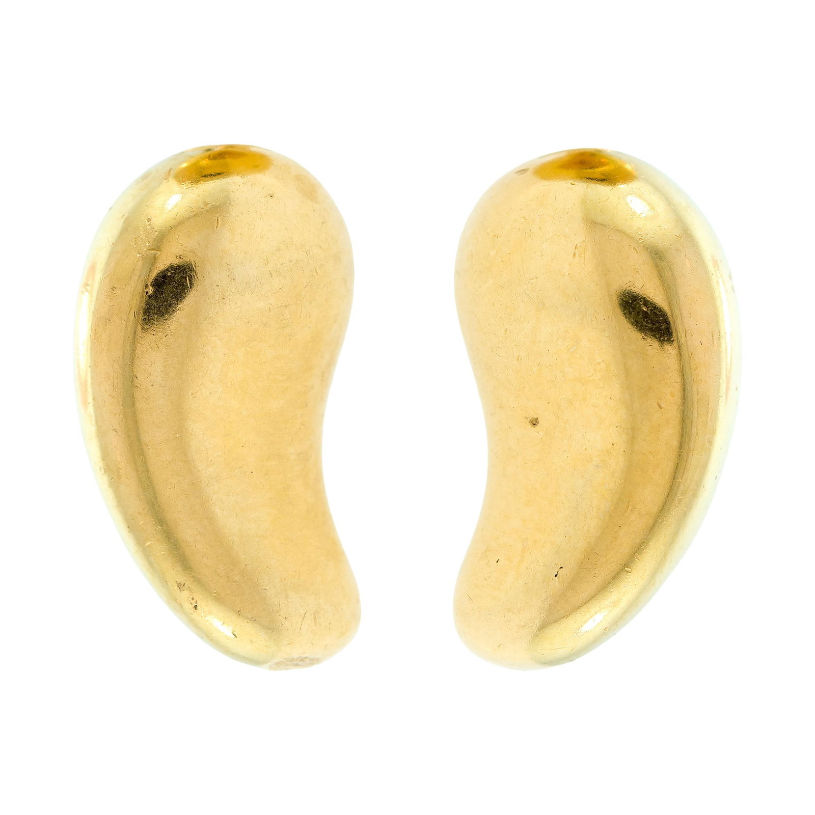 TIFFANY & CO. E. PERETTI 18K GOLD BEAN CLIP EARRINGS.: A pair of signed, Tiffany & Co., Elsa Peretti, 18k yellow gold (stamped), bean clip earrings, 7/8 of an inch long, 12 grams.