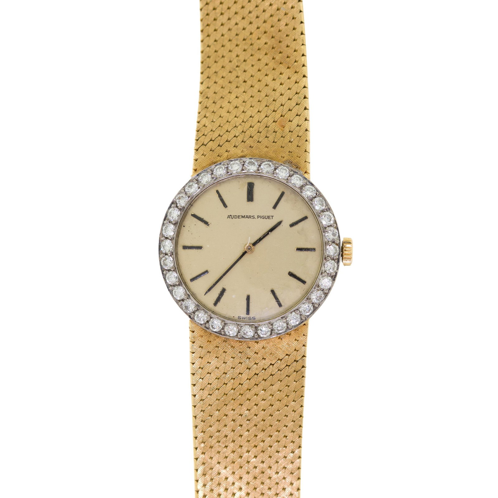 VINTAGE AUDEMARS PIGUET 18K GOLD DIAMOND WATCH.: A lady's vintage, 18k yellow gold (stamped, hallmarks), Audemars Piguet wrist watch with a diamond bezel, approx. .64 ct. tw., round brilliant cut, natural diamonds of F-G color and VS clarity, 21mm