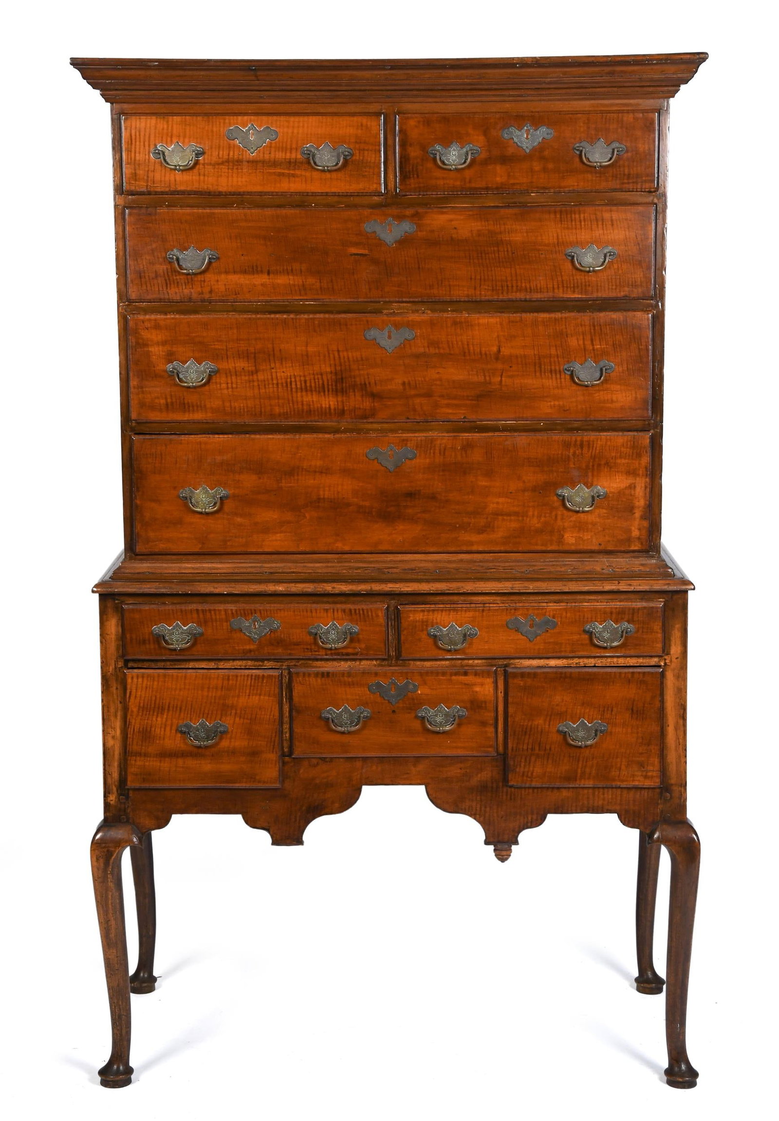 18TH C. QUEEN ANNE CURLY MAPLE NE HIGHBOY: A ca. 1740-1760 New England Queen Anne curly maple highboy in two parts, the upper section with a molded cornice over two short drawers above three long graduated drawers, the lower section with a