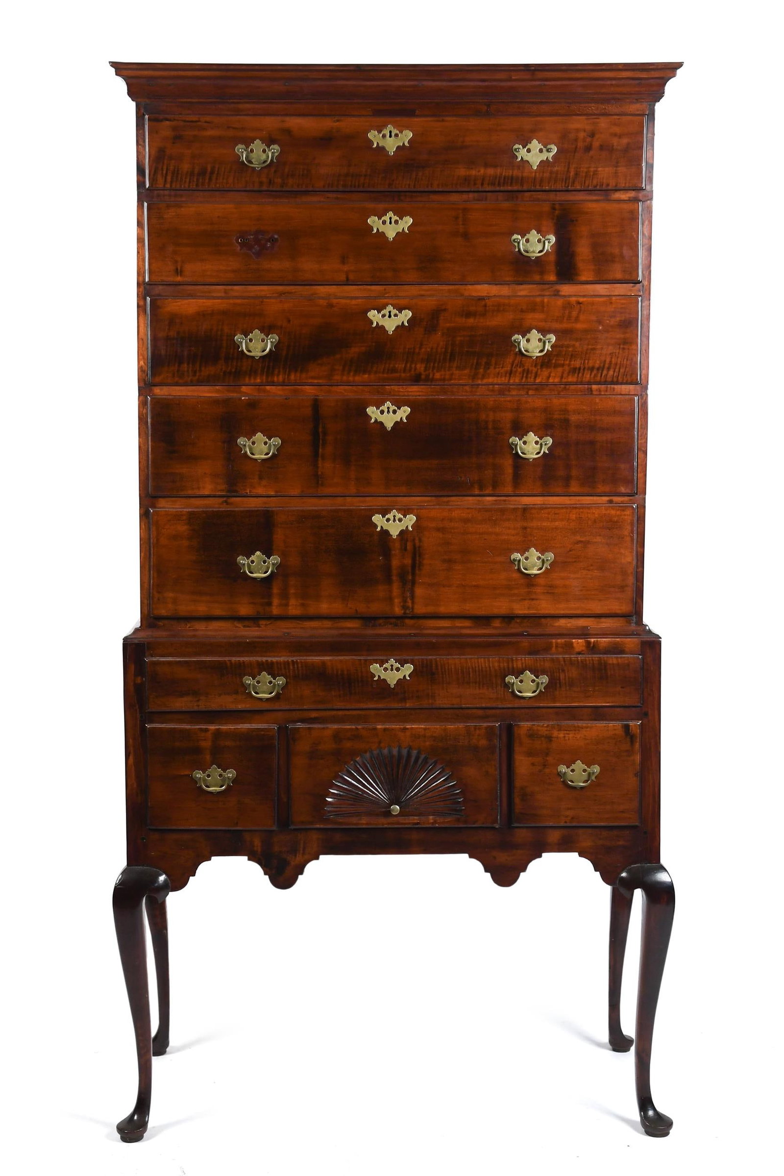 18TH C. QUEEN ANNE NE CURLY MAPLE HIGHBOY.: A ca. 1760 New England Queen Anne curly maple highboy in two sections. The upper section with a stepped cornice molding over five graduated long drawers. The base section with a single long drawer