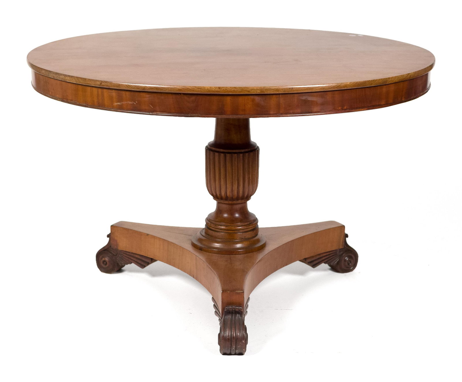 19TH C. REGENCY MAHOGANY CENTER TABLE.: A ca. 1820 Regency mahogany center table, with a 2 board round tilt top with early iron hardware, a fluted carved pedestal supported by a tri-foot base. 28.75”H x 45” dia.