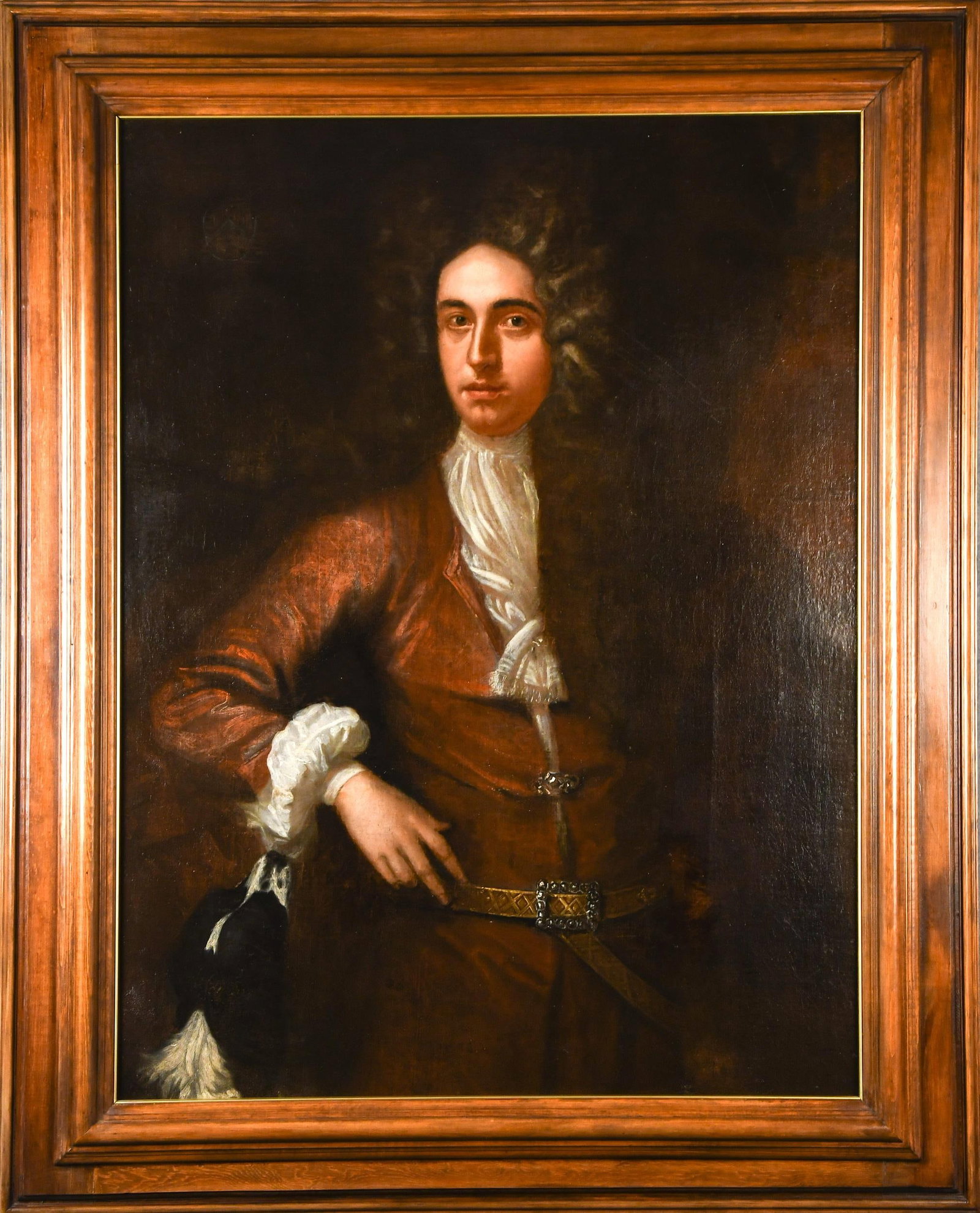18TH C. PORTRAIT OF A GENTLEMAN.: An 18th C. oil on canvas, Continental School portrait of a gentleman, depicting a finely dressed man in late 17th or early 18th century attire, including a russet coat with white lace cravat and
