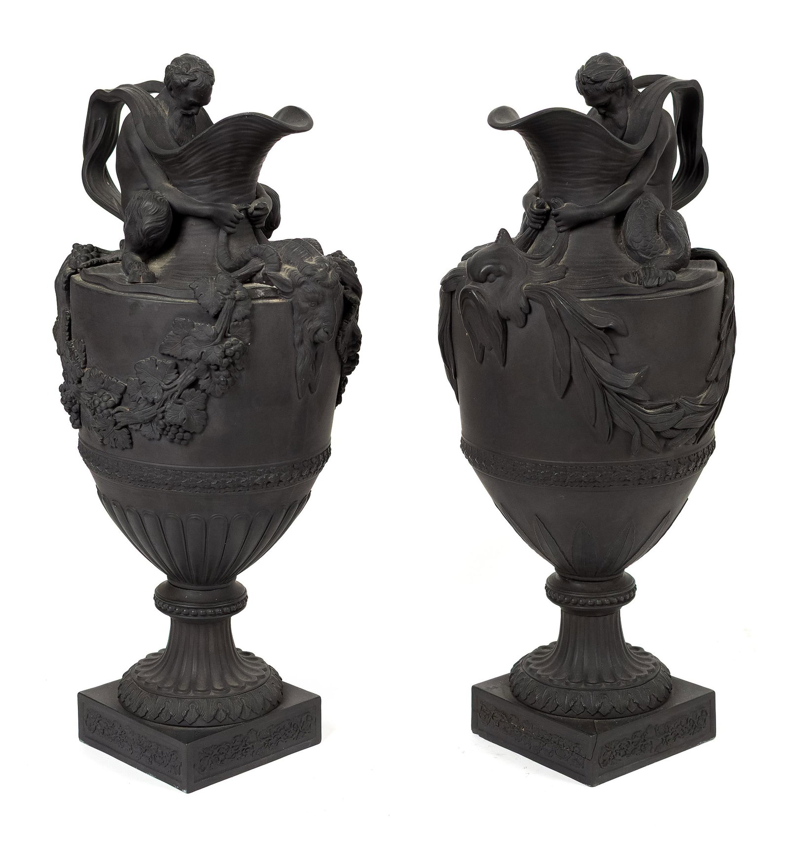 PR. WEDGWOOD BLACK BASALT WATER AND WINE EWERS.: A pair of 19th C. Wedgwood black basalt ewers, baluster-form bodies with fluted pedestals and square bases, water ewer with a merman holding the fins of a dolphin at the neck, and ewer draped with
