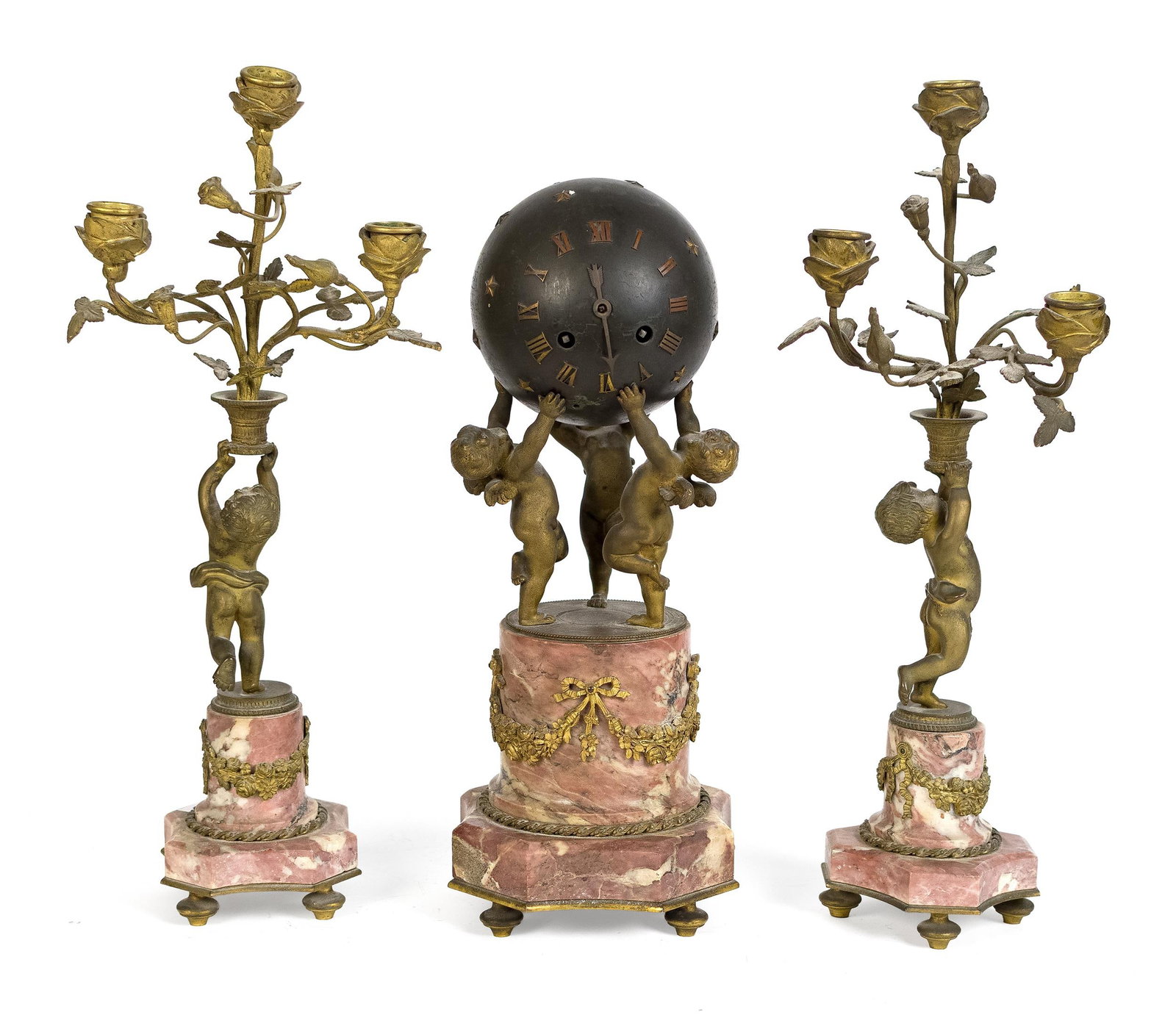 FRENCH BRONZE AND MARBLE FIGURAL MANTEL CLOCK SET.: A ca.1890 French mantel clock with a decorated and patinated bronze orb being supported by three dore gilt infants/cherubs, on a rouge marble base with dore gilt mounts. 15.25”H. Complimented by