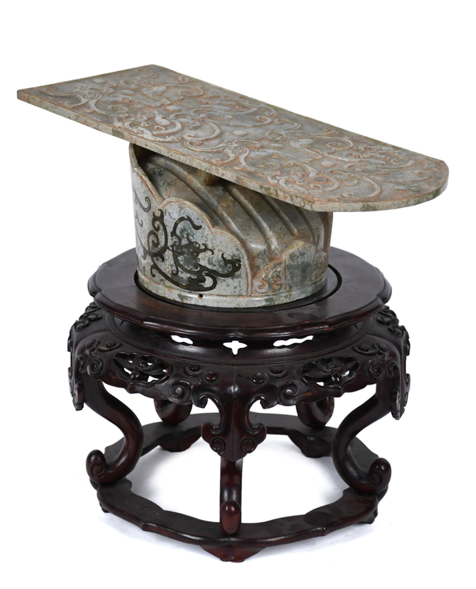 CARVED JADE CHINESE CEREMONIAL HEADPIECE.: An antique carved two-piece Chinese jade ceremonial head-piece or crown. The rectangular headrest tablet is carved overall with dense scrolling cloud and dragon motifs in low relief, with gently arche