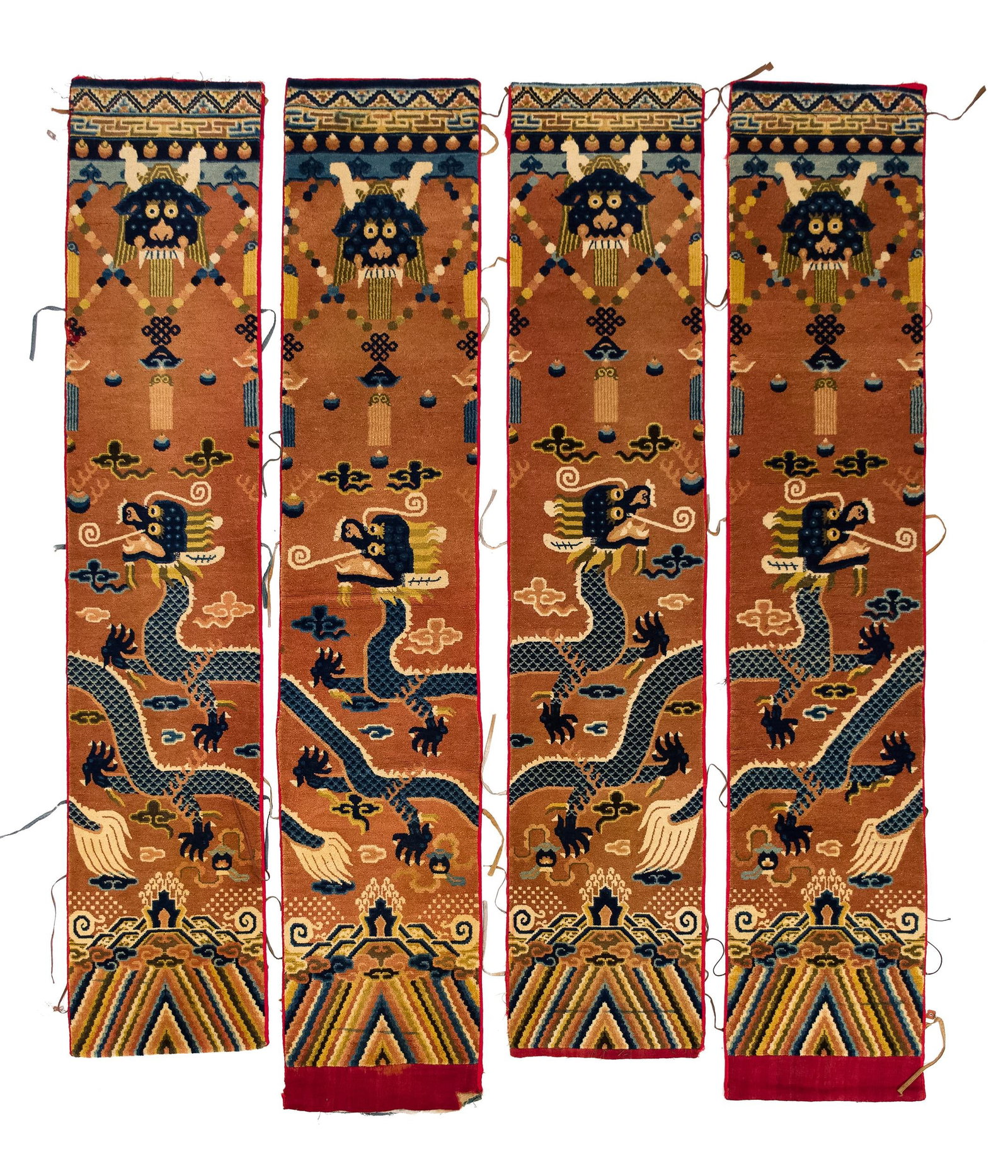 RARE 19TH C. CHINESE DRAGON PILLAR RUGS, SET 4.: 19th C. set of four Chinese wool pillar rugs, woven for a Tibetan Buddhist temple and designed to wrap around the columns of the hall so that the dragon spirals upward. Each with a key fret and pearl 