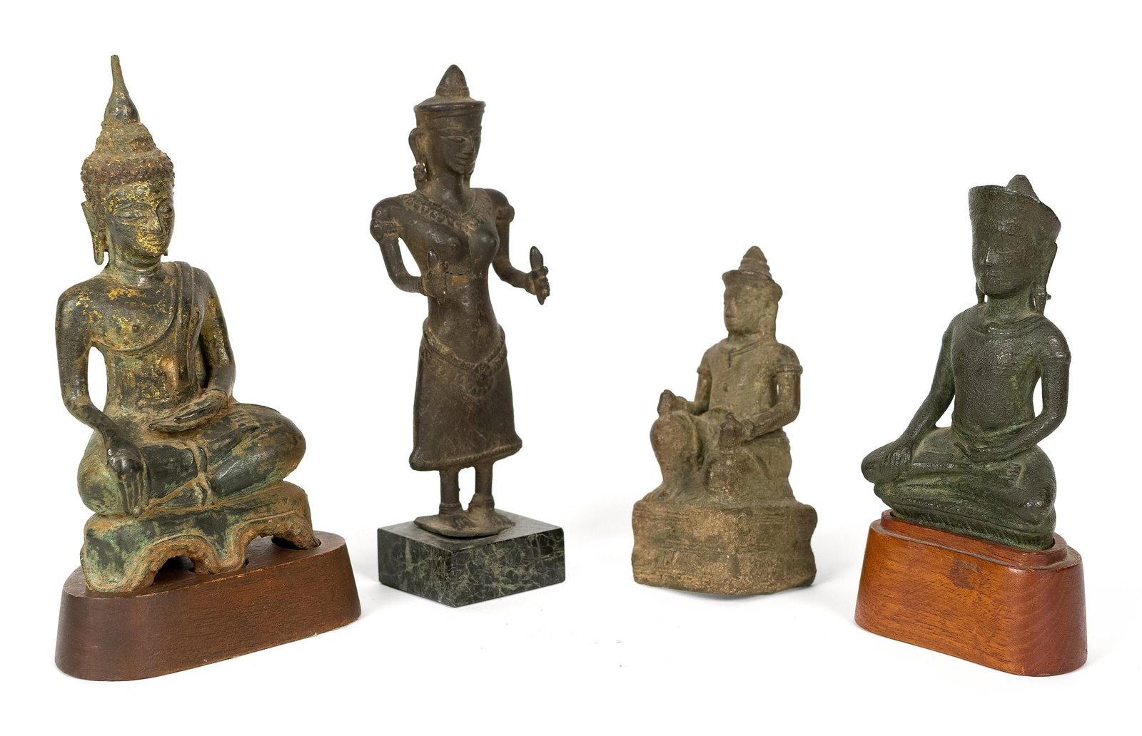 FOUR ANTIQUE SOUTHEAST ASIAN BRONZE FIGURES.: 18th/19th C. a group of four Southeast Asian bronze figures. Comprising a Thai or Lao seated Buddha in the earth touching pose, with a tall flame finial and remnants of gilt lacquer, on a waisted