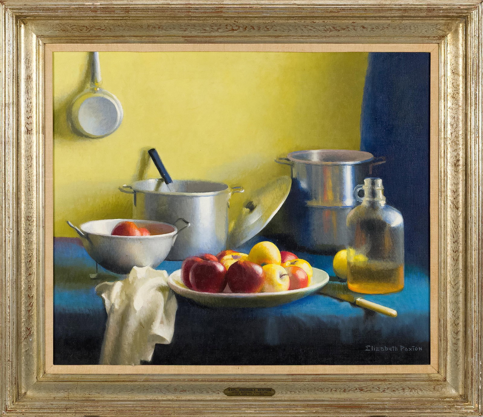 ELIZABETH OKIE PAXTON O/C KITCHEN STILL LIFE.: Elizabeth Okie Paxton (American, 1877-1971). A kitchen still life, a dish of red and yellow apples on a blue draped table with an aluminum colander, stock pot and double boiler, a glass jug of cider, 